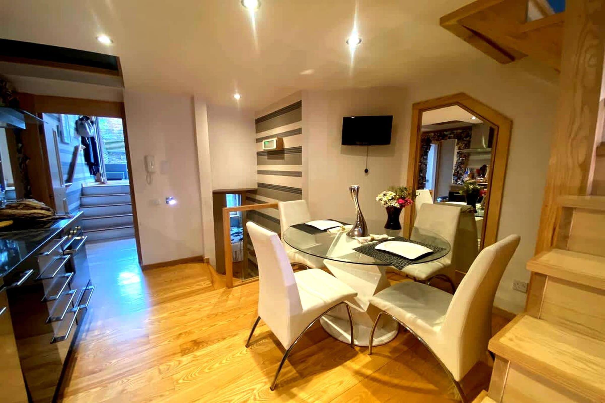 Tucked within the vibrant neighbourhood of Fulham, this well-laid-out apartment offers a comfortable London stay with the added benefit of private outdoor space. Designed for up to five guests, it combines a practical layout with a central location close to transport links, cafés, and local attractions.

Inside, the apartment features two bedrooms, each with its own en-suite bathroom, providing added privacy and convenience for groups or families. The layout includes a spacious living area with seating and a dining space, while parquet flooring and a private entrance enhance the overall feel of the home. A fully equipped kitchen includes essential appliances and cookware, along with a washing machine for longer stays. Additional features such as Wi-Fi, heating, ironing facilities, and storage make the space functional for both short and extended visits.

The standout feature is the private patio, accessible directly from the kitchen, offering a quiet outdoor setting for meals or relaxation. Guests also benefit from access to a garden-style space with outdoor seating and a picnic area, creating a rare indoor-outdoor balance in a city setting.

Located on Dawes Road in Fulham, the apartment sits within walking distance of Fulham Broadway and Parsons Green stations, providing easy connections across London. Nearby highlights include Stamford Bridge Stadium, local cafés, grocery stores, and riverside walks, while central attractions such as Hyde Park and Buckingham Palace are within easy reach. With its en-suite layout and private patio, this apartment is well-suited for a comfortable and well-connected city stay.