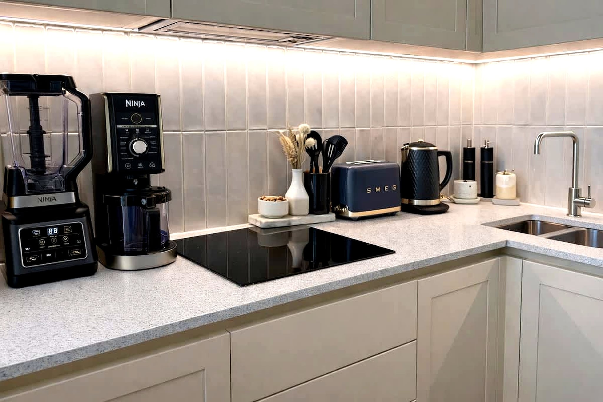 Overlooking the leafy surroundings of Chiswick, this well-appointed apartment in the Renaissance Square development offers a calm and refined London stay. Located right next to Chiswick House & Gardens, it combines green open space with easy access to cafés, restaurants, and transport links into central London.

Inside, the apartment features two bedrooms, each with a double bed, along with two bathrooms fitted with bathtubs, toilets, and hairdryers, providing added comfort for groups or families. The living area is designed as a welcoming gathering space, with cozy seating, a dedicated workspace, and room to relax or work with ease. A fully equipped kitchen includes a stove, oven, microwave, and dishwasher, making it suitable for both short and extended stays. Additional conveniences such as a washing machine, tumble dryer, heating, and essential amenities ensure a smooth and comfortable experience.

The apartment extends outdoors with a private patio and access to a garden area, offering a peaceful setting rarely found in city stays. Outdoor seating allows for quiet mornings or relaxed evenings, while the surrounding greenery enhances the overall sense of space and calm.

Situated in a safe and well-connected neighbourhood, the apartment is within walking distance of local cafés, shops, and scenic walking routes through Chiswick House & Gardens. Excellent transport connections provide easy access to central London, making it a convenient base for both leisure and business stays. With its balanced mix of comfort, greenery, and location, this apartment is ideal for a relaxed city escape.