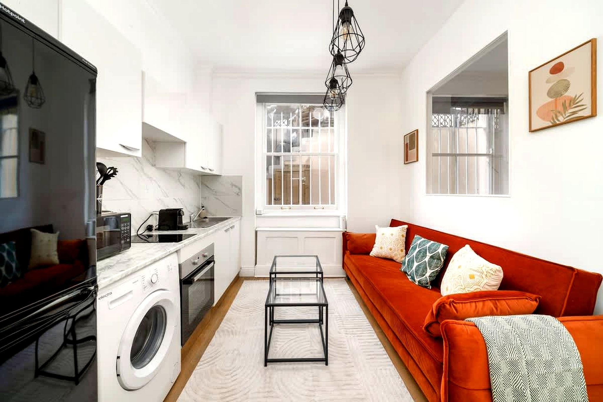 A rare find in this part of London, this bright apartment combines a private garden with a well-connected location just a short walk from West Kensington Underground Station. Ideal for up to four guests, it offers a comfortable base close to Kensington, Fulham, and Chelsea while still providing a quieter space to unwind.

Inside, the apartment features two bedrooms, each with a double bed, making it well-suited for families, friends, or colleagues travelling together. The living area is arranged as a relaxed gathering space with cozy seating and a TV, creating a comfortable spot to unwind. A fully equipped kitchen includes a stove, oven, microwave, and dishwasher, supporting easy self-catering. The bathroom is fitted with a shower, toilet, and hairdryer, while additional amenities such as Wi-Fi, heating, washing machine, and tumble dryer ensure a smooth stay.

The highlight of the property is its private garden, offering a peaceful outdoor setting rarely found in city apartments. This space provides room to relax, enjoy fresh air, or spend quiet moments away from the pace of the city.

Located within a 3-minute walk of West Kensington Station, the apartment provides excellent transport connections across London. Nearby areas such as Kensington, Fulham, and Chelsea offer a wide range of cafés, restaurants, and shops, along with easy access to key attractions. With its garden space and strong location, this apartment is ideal for a comfortable and well-connected city stay.