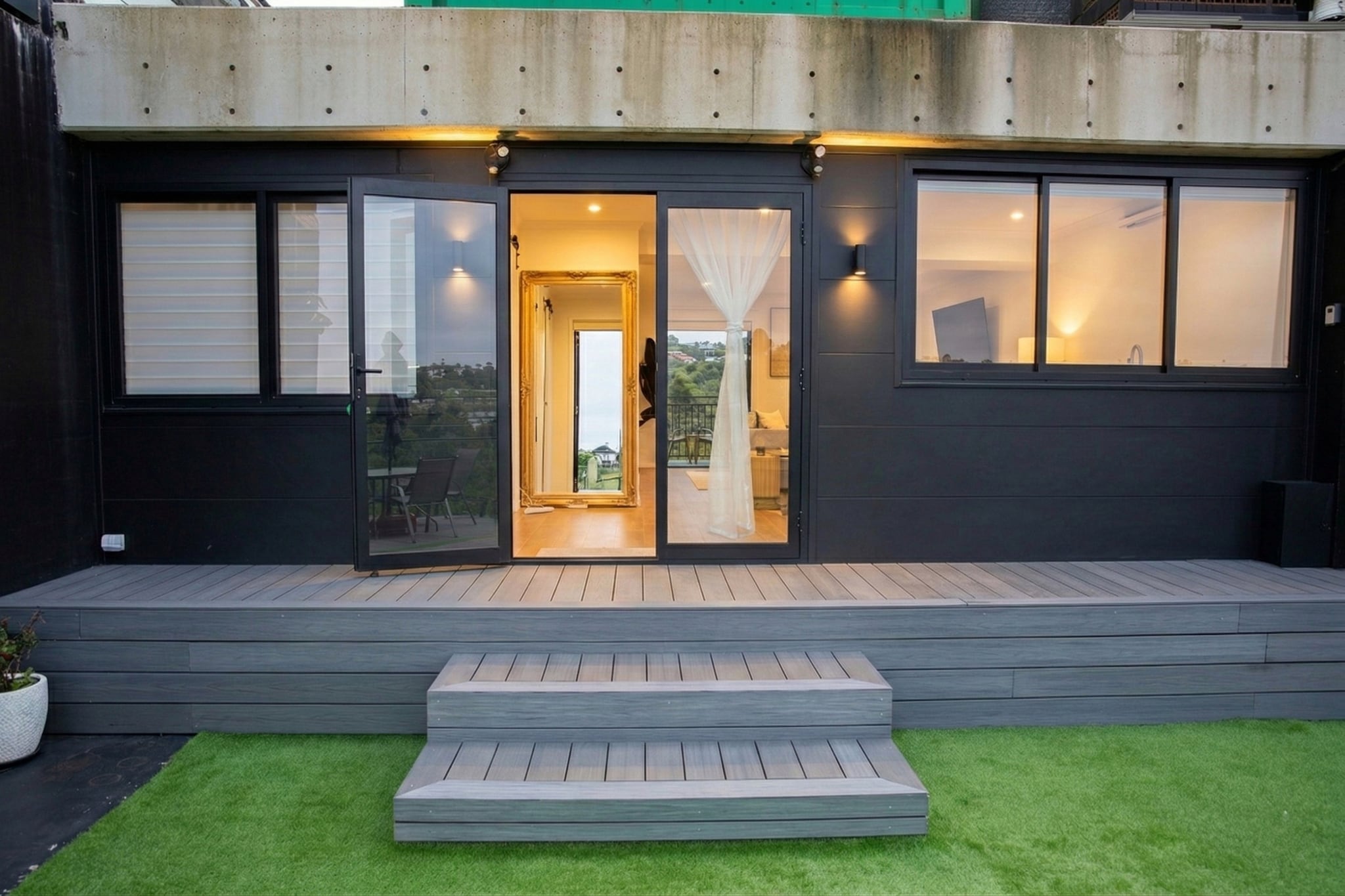 Property description
Set in peaceful Kiama, this private 1-bedroom townhouse offers a relaxing coastal escape with beautiful views and access to a garden area. Featuring open plan living, a kitchenette, and self check-in via onsite lockbox, it’s ideal for couples seeking a quiet stay near the coast.
The space
This cosy and inviting townhouse provides a peaceful retreat surrounded by scenic coastal views. The living area features warm wooden flooring and a comfortable three-seater couch, creating a relaxing place to unwind. Styled with decorative touches and artificial plants, the space feels bright and welcoming.
 
A small dining area with seating for two sits beside the kitchenette, which is equipped with an induction cooktop, microwave, refrigerator and capsule-compatible coffee machine. Whether preparing a quick breakfast or an evening snack, the layout offers convenience for shorter stays.
 
The bedroom features a queen bed with bedside tables and lamps, along with built-in storage and wooden hangers to keep belongings organised. A ceiling fan provides airflow, while blackout curtains help ensure restful sleep.
 
The bathroom is modern and well-appointed, featuring a shower, vanity and essential amenities.
 
Step outside to enjoy the garden area located in front of the townhouse, where outdoor furniture offers a pleasant space to relax and take in the surrounding scenery. With its private entrance and quiet setting, this townhouse is well suited to couples looking for a peaceful getaway.