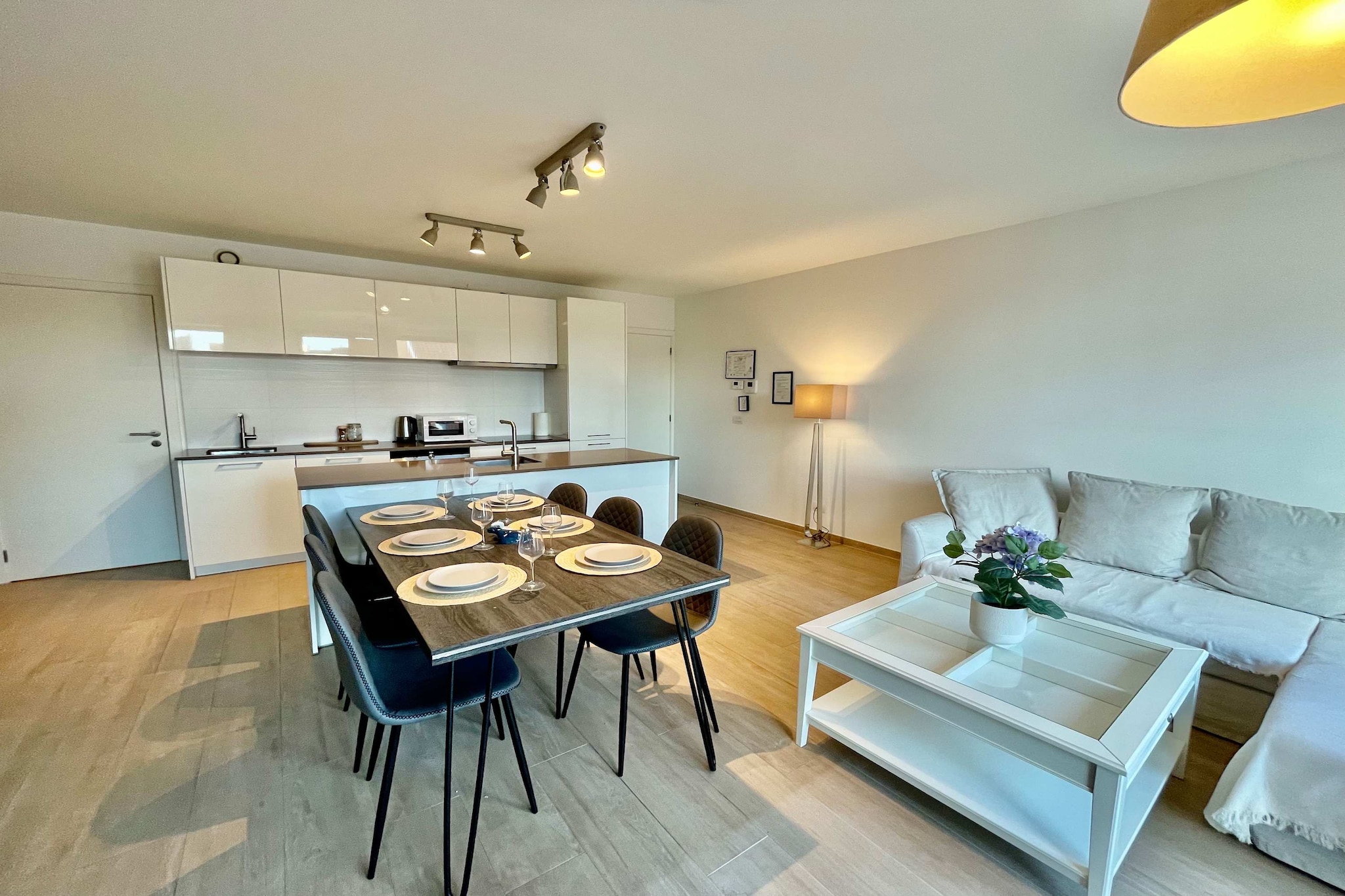 Located in the heart of Antwerp, this sophisticated 2BR apartment by OneLuxStay offers a bright, design-forward sanctuary near the renowned Diamond District. Whether visiting for a family break or an extended stay, guests will enjoy a refined environment that balances contemporary style with effortless accessibility to the neighborhood's best transit links and local attractions.

The interior is masterfully curated to accommodate up to four guests, featuring a master bedroom with a plush king-sized bed and a second bedroom with two comfortable single beds. For those balancing work and travel, a dedicated workspace is provided alongside high-speed Wi-Fi. The kitchen is fully equipped for self-catering with an oven, refrigerator, and coffee maker, while the in-unit washer and ample storage offer added convenience for long-term stays.

The well-appointed bathroom is stocked with premium essentials, including a hairdryer and shampoo. Families are warmly welcomed, as the suite is fully suitable for both infants and children. Safety is prioritized with integrated heating and comprehensive smoke detection. Guests also benefit from a luggage drop-off service and paid parking options located nearby. With its blend of superior design and central location, this OneLuxStay residence offers a distinguished experience in one of Antwerp's most iconic districts.