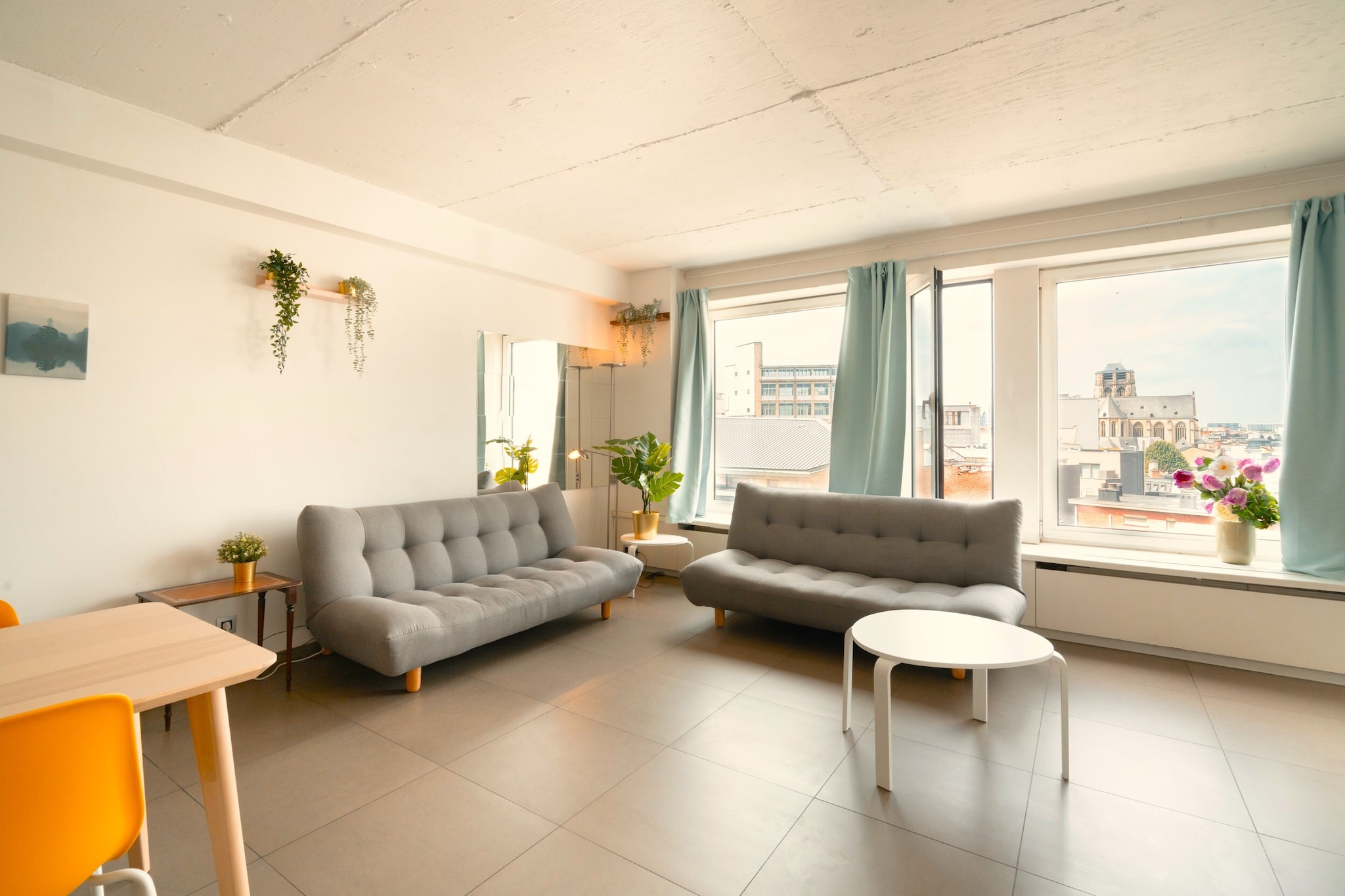 Right in the heart of Antwerp, this spacious one-bedroom apartment is designed for groups who want to stay together while exploring the city with ease. Located just a short walk from the central station and key attractions, it offers a practical base for larger groups looking to experience the city without splitting into multiple rooms.

Inside, the apartment is configured to accommodate up to ten guests within a flexible layout. The sleeping arrangement is spread across one bedroom, along with the living room, with a combination of double beds, single beds, and futon beds, plus sofa beds to suit group stays. A dining area and seating space create room to gather, while the fully equipped kitchen includes appliances such as a refrigerator, oven, cooktop, and essential cookware for easy self-catering. A private bathroom with a walk-in shower and toilet completes the setup, while amenities like Wi-Fi and heating add everyday comfort.

The apartment is serviced by a lift and offers city views, adding to the convenience of staying in a central urban setting. Its layout prioritizes functionality and capacity, making it especially suitable for short stays, group trips, or budget-conscious travellers.

Located in central Antwerp, the property is within walking distance of major landmarks such as Antwerp Central Station, Rubens House, and shopping streets. With its central location and high guest capacity, this apartment is ideal for groups seeking a convenient and well-connected city stay.