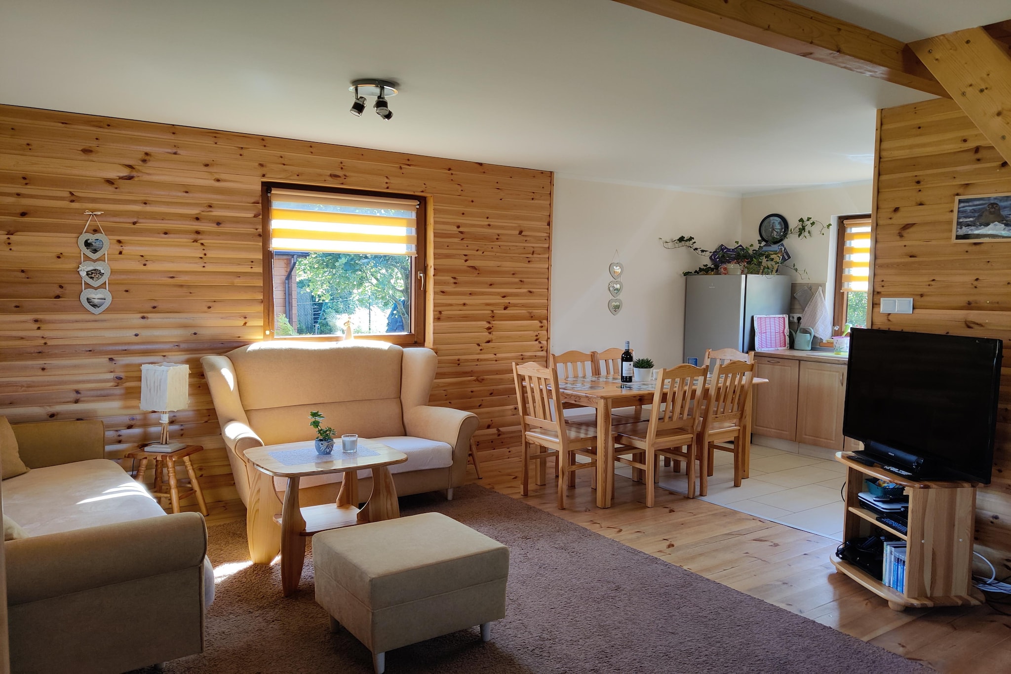 Located in the quietest part of the Polish coast, in the buffer zone of Słowiński National Park, just over 4 km from the beach and just over 2 km from the lake. The house is situated on private property shared from May to September with guests from the neighboring holiday home. Outside of this period, the grounds are for the exclusive use of guests from the larger house.
This comfortable, large holiday home features a covered terrace with garden furniture. The house is on two levels. On the ground floor there is a spacious living room, a well-equipped kitchen (including an oven, dishwasher, microwave, and coffee maker), and a bathroom with a shower (including a washing machine). On the first floor there are three separate bedrooms. Electric heating and wireless internet are available.
The fenced property includes secure parking, barbecue facilities, deckchairs, and a children's playground.
The price includes: bed linen, towels, electricity, water, heating, parking, and internet. A cot and highchair are available upon request. The region's signature feature is the Czołpińska Dune and its beautiful and unique walking trail (for those who enjoy sand in their shoes). Nearby, right on the seashore, you'll climb 200 steps on a picturesque forest trail to reach the lighthouse. Here you'll find the longest and most beautiful wild beach in Poland (almost 40 km). On your way back from the lighthouse to Smołdziński Forest, it's worth stopping at the viewing platform (with views of the sea and dunes) and the white-tailed eagle aviary. A little further west, you'll find a submerged forest on the beach, boasting impressive tree roots and trunks that are 3,000 years old. The jetties at the nearby Dołgie Wielkie and Małe lakes are ideal stops on forest bike rides.