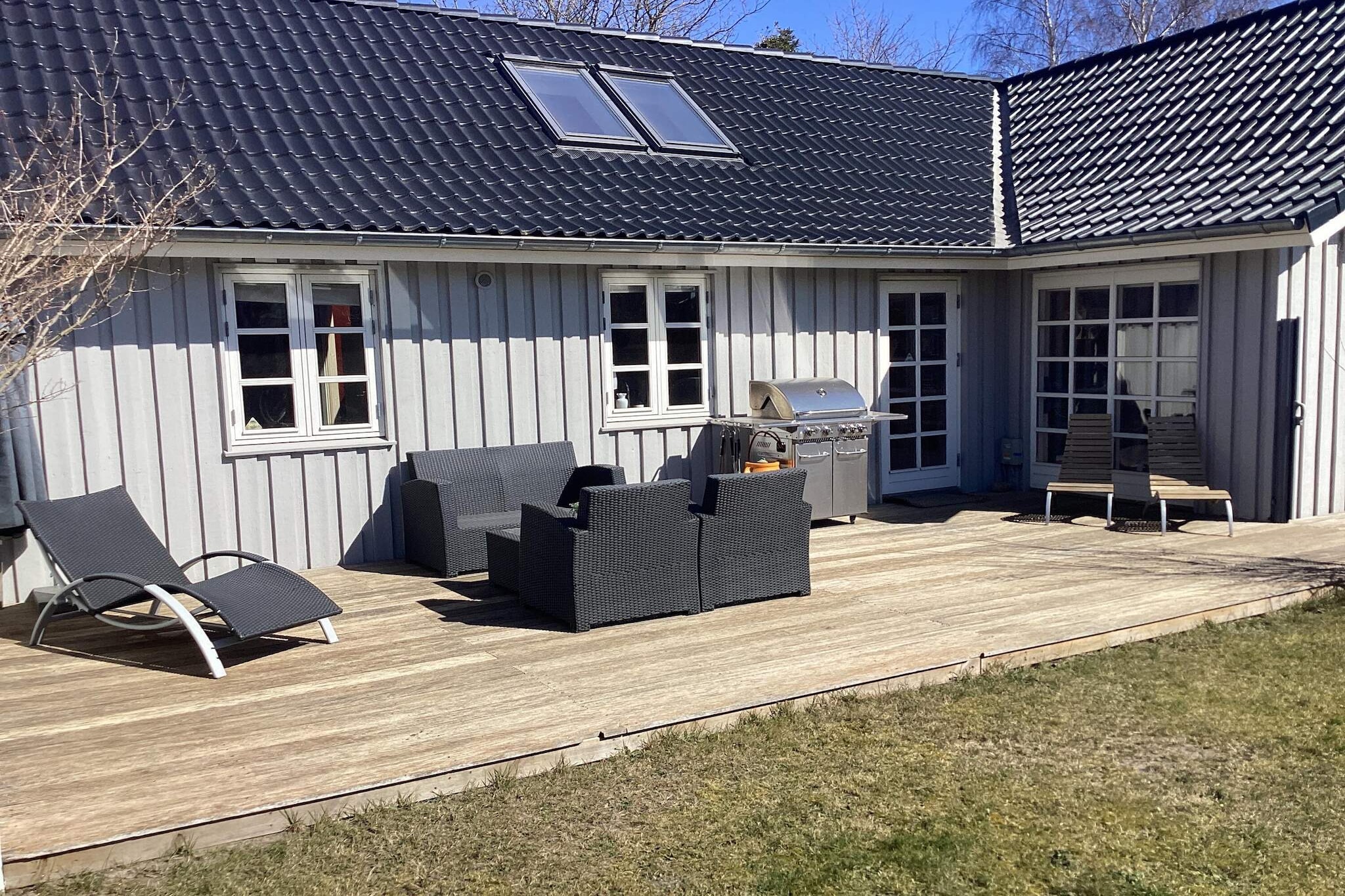 This incredibly cosy 91 m² spa holiday home enjoys a superb location – just a stone’s throw from the centre of Marielyst, where everything is within easy reach – from grocery shopping and retail to restaurants and attractions – and just 750 metres from one of Denmark’s best and most child-friendly beaches. The holiday home is bright and modern, featuring an open-plan kitchen equipped with a coffee machine, induction hob, separate oven, microwave, fridge-freezer and dishwasher. The living room has a TV with Chromecast and internet, as well as an air-to-air heat pump, and on cold days you can use the wood-burning stove, which provides lovely warmth and cosiness. The holiday home has three bedrooms; two of the rooms have double beds and a bunk bed in the third room. On one loft there is a single bed, and on the other loft, a really cosy space for children and the young at heart, as the loft features a games console, beanbags and various board games. The house’s large bathroom, with lovely underfloor heating, features a washbasin, toilet, shower, washing machine and tumble dryer, as well as a lovely two-person spa bath, which is perfect for relaxing in after a long day out and about. This gem is set on a 700 m² plot with plenty of space for play and games – you certainly won’t get bored here. The garden features a swing set, a playhouse, a hammock and football goals. You can also relax around the fire pit or pop into the garden pavilion if it happens to rain. On those lovely, warm summer days, you can sit on the terrace, which has a gas barbecue, garden furniture and sun loungers. Not available for hire to youth groups.A refundable deposit might be charged closer to your check-in date. The security deposit ensures a smooth stay and covers any additional services or consumption charges.This deposit covers utilities consumed during your stay and any additional services that may be taken.The final amount will be adjusted based on actual meter readings, actual usage of extra services, and any remaining balance will be refunded within 21 days after checkout.This deposit simply acts as a prepayment for charges that  you would anyways pay for, ensuring a seamless stay and check-out experience.