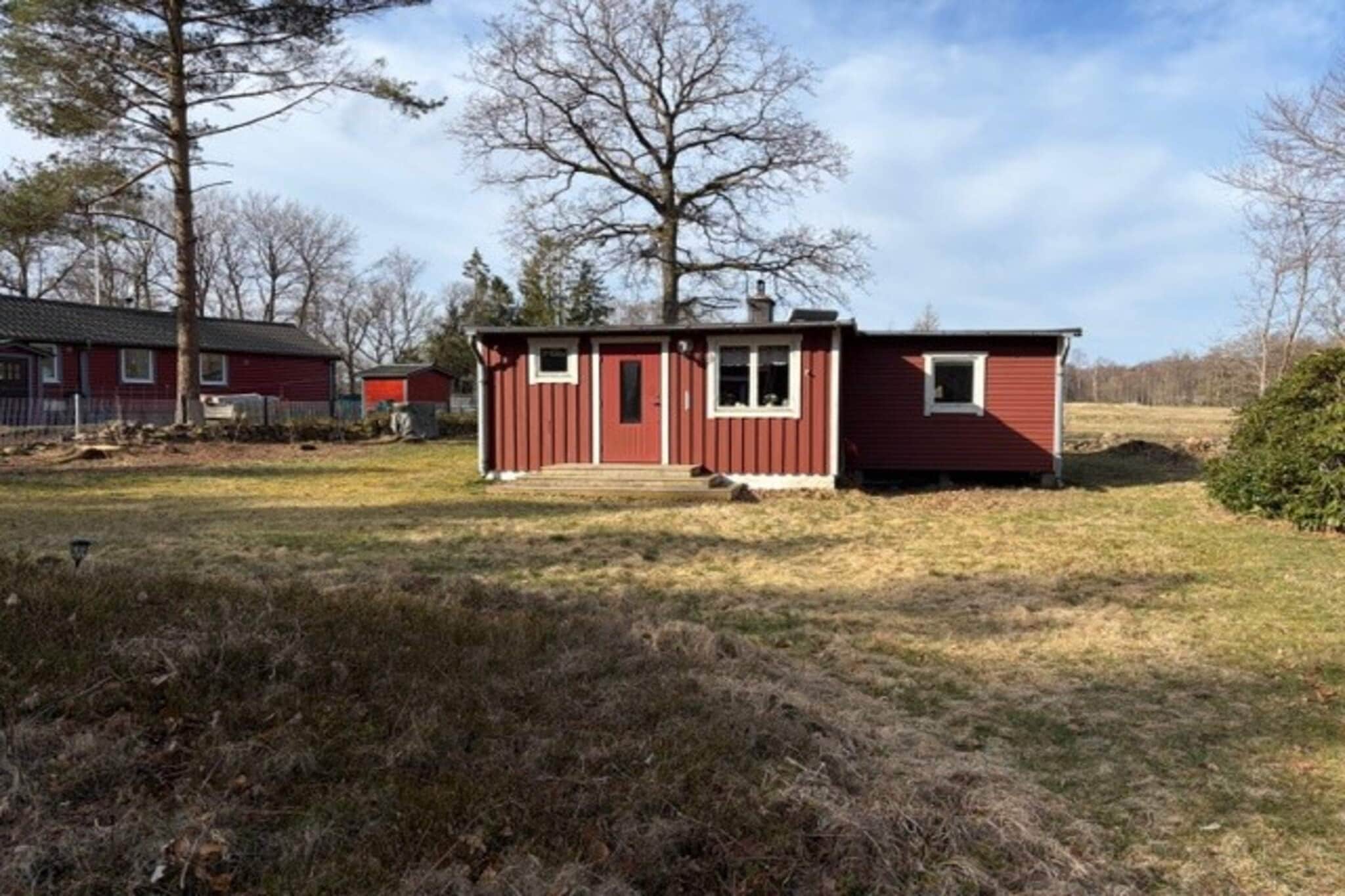 Cozy cottage just outside Kvidinge in northwestern Skåne. Ideal accommodation for those who want to relax and just be with the scenic surroundings around the corner. The kitchen has a stove with 3 hotplates, oven, refrigerator and microwave. Freezer is in one of the bedrooms. Cozy living room with sofa and wood-burning stove. The TV is of the older type but there is a DVD player and several DVD films in case you need it. There are two bedrooms, one with a double bed and one with bunk beds. Bathroom with toilet and shower. On the nice balcony you can sit down and maybe put something good on the grill as a nice end to a wonderful day. Or why not take a cup of coffee outside and enjoy a new day as it dawns. The cottage is in a great location to either unwind and discover the nature in the surrounding area or to go on excursions. Convenient if you want to go to the sea in Ängelholm or visit popular Helsingborg with sun, swimming, shopping and a wide range of events and activities.