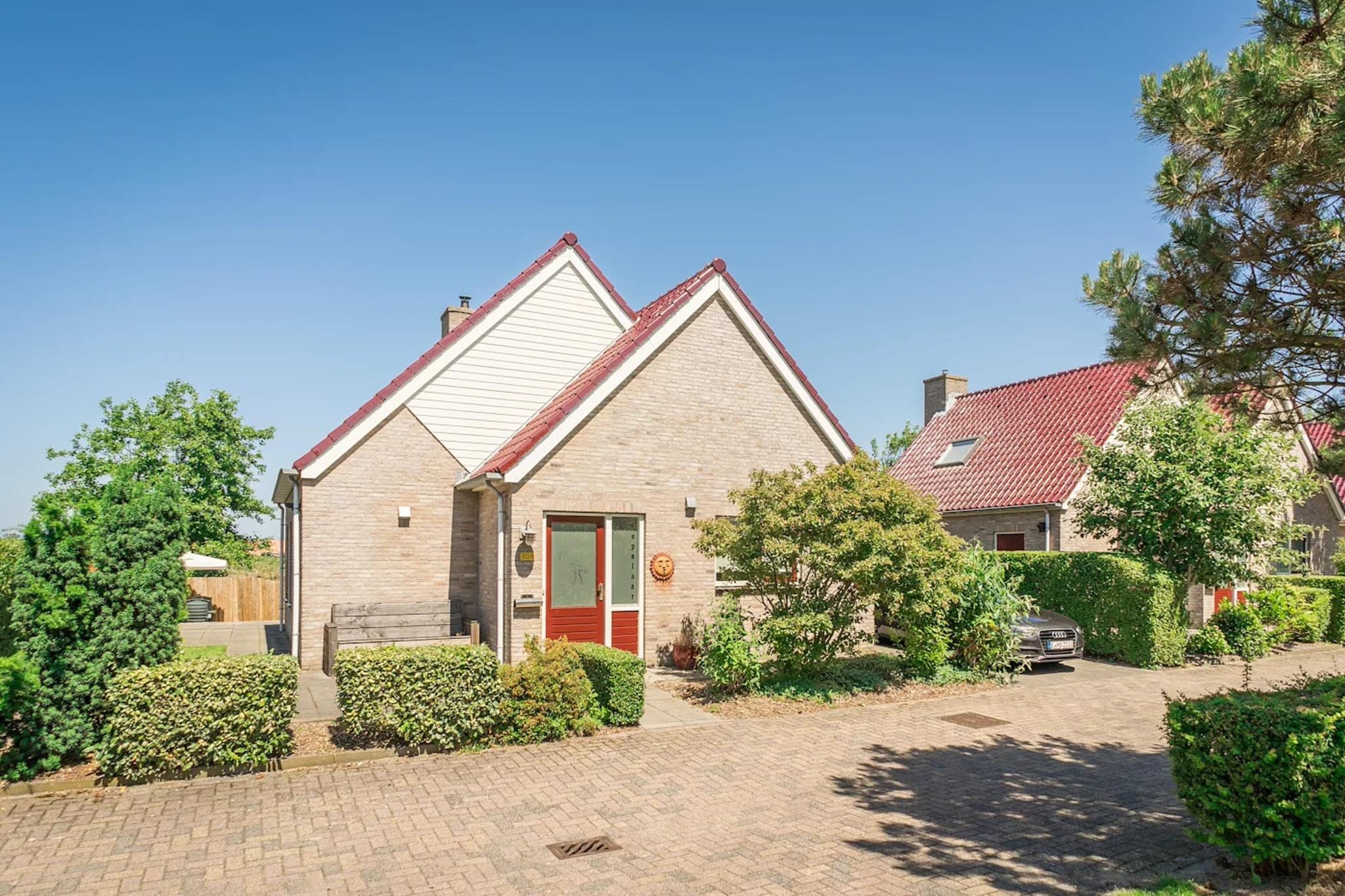 Luxury 4-person villa in a nature reserve on Texel - Buitenkant zomer