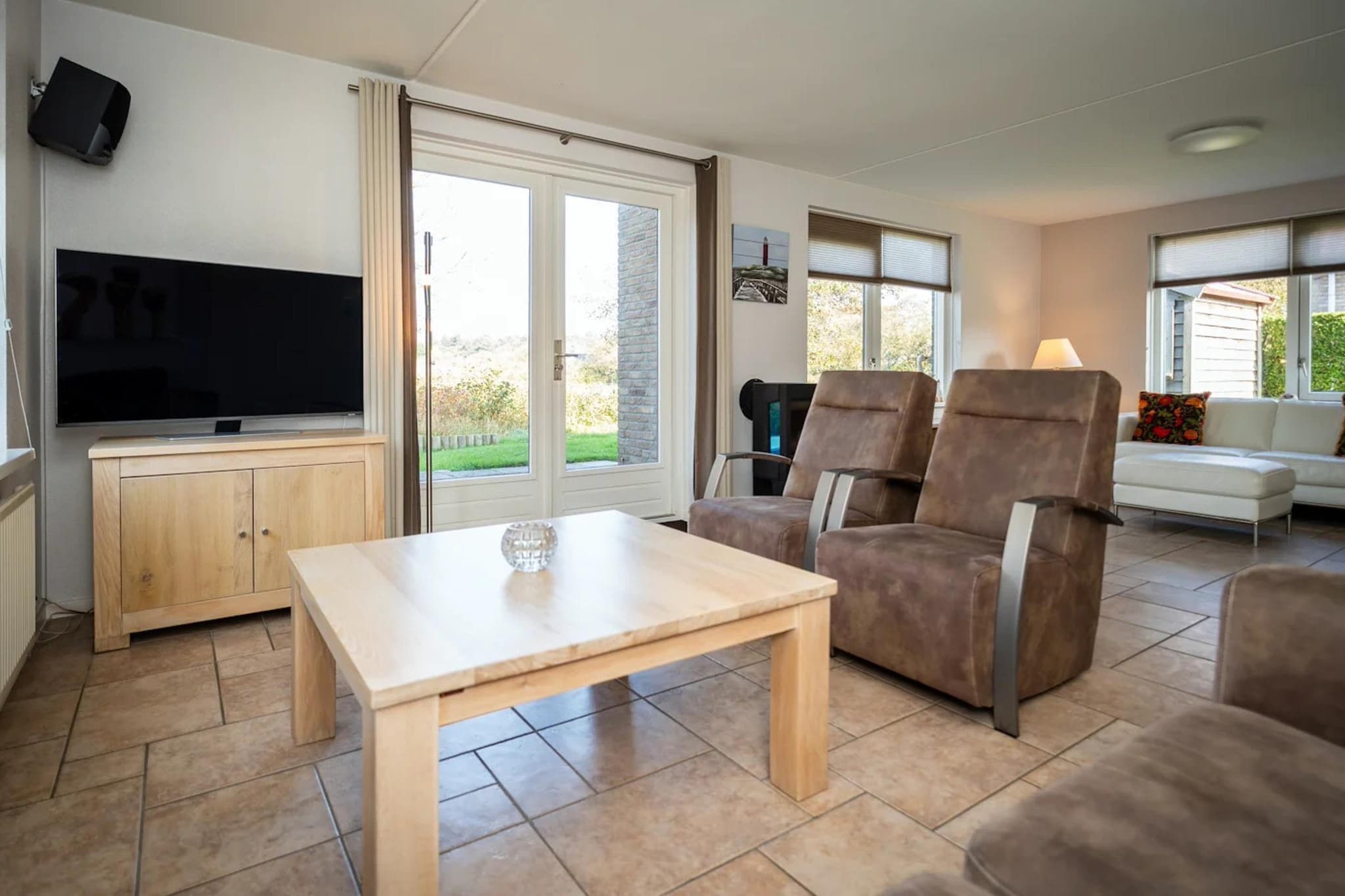 Luxury 4-person villa in a nature reserve on Texel - Woonkamer