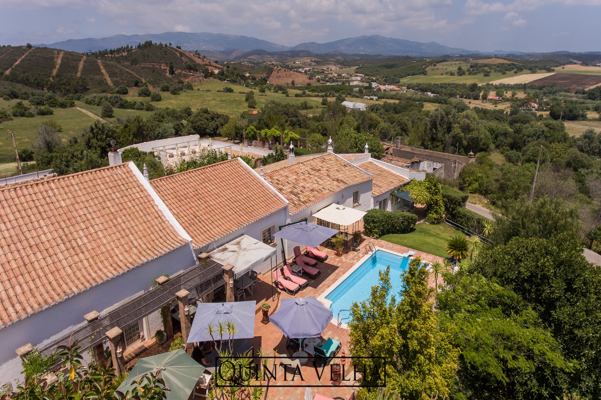 With serene surroundings all around, this restored holiday home in Portimão has 2 bedrooms, which can house 4 people. Ideal for a small family or holidayers, this home features a shared pool and terrace.
The supermarket and restaurants are located within 5 km from the home. Public pool is 6 km away, where you can refresh yourself. The town centre (10 km) with all the families is also nearby. You can also go on a day trip to the beautiful lake (15 km). 
Enjoy the sun or shade in the private garden or terrace. There is a swimming pool for the active ones too. Stay cool in summers and cosy in winters with high wooden ceilings and stone walls. Being a child-friendly property, the cot and high chair is also available.
Airport is 75 km away.
The holiday home is situated on the same property as the house of the homeowner. They have 2 pet lovable dogs, but if you prefer to stay isolated from them then you can request the owner to keep them in their own enclosure.