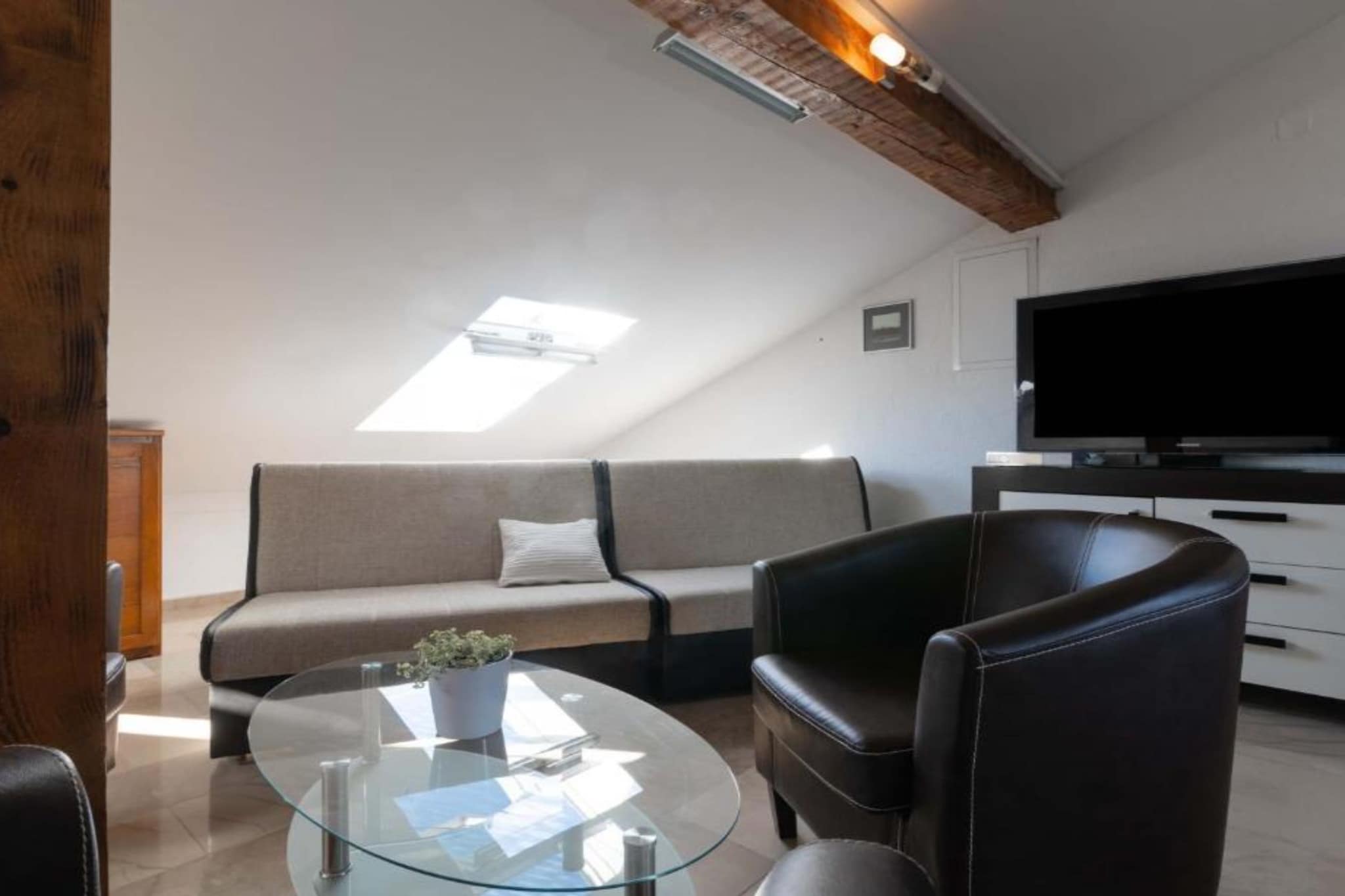 Kokolo Beach Apartments - Studio apartment (Roof) - Woonkamer