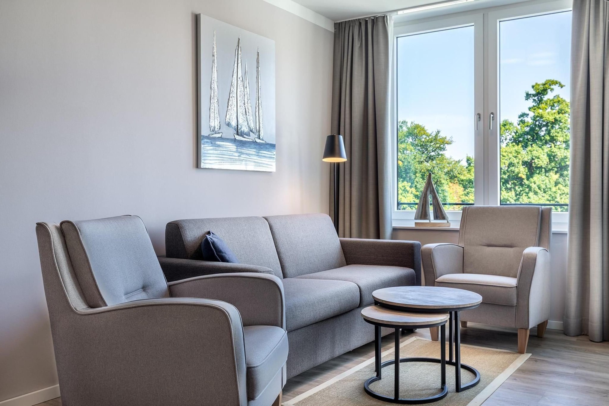 Godewindpark Travemünde Deluxe-Apartment 2.14 mit eigener e-Ladesäule, XL-Strandkorb und Hundefreundlich - Woonkamer