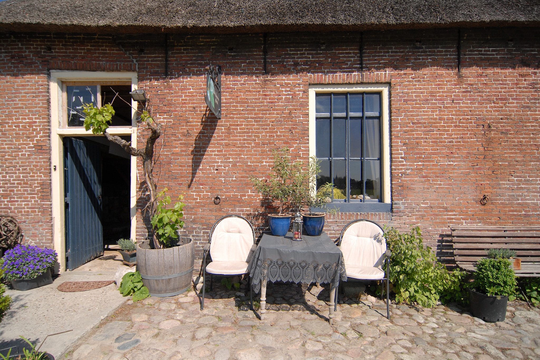 Ground floor: (open kitchen(oven, microwave), Living/bed room(double bed), bathroom(shower, washbasin, toilet))\n\npatio, heating(central), terrace, garden furniture, bicycles available, high chair