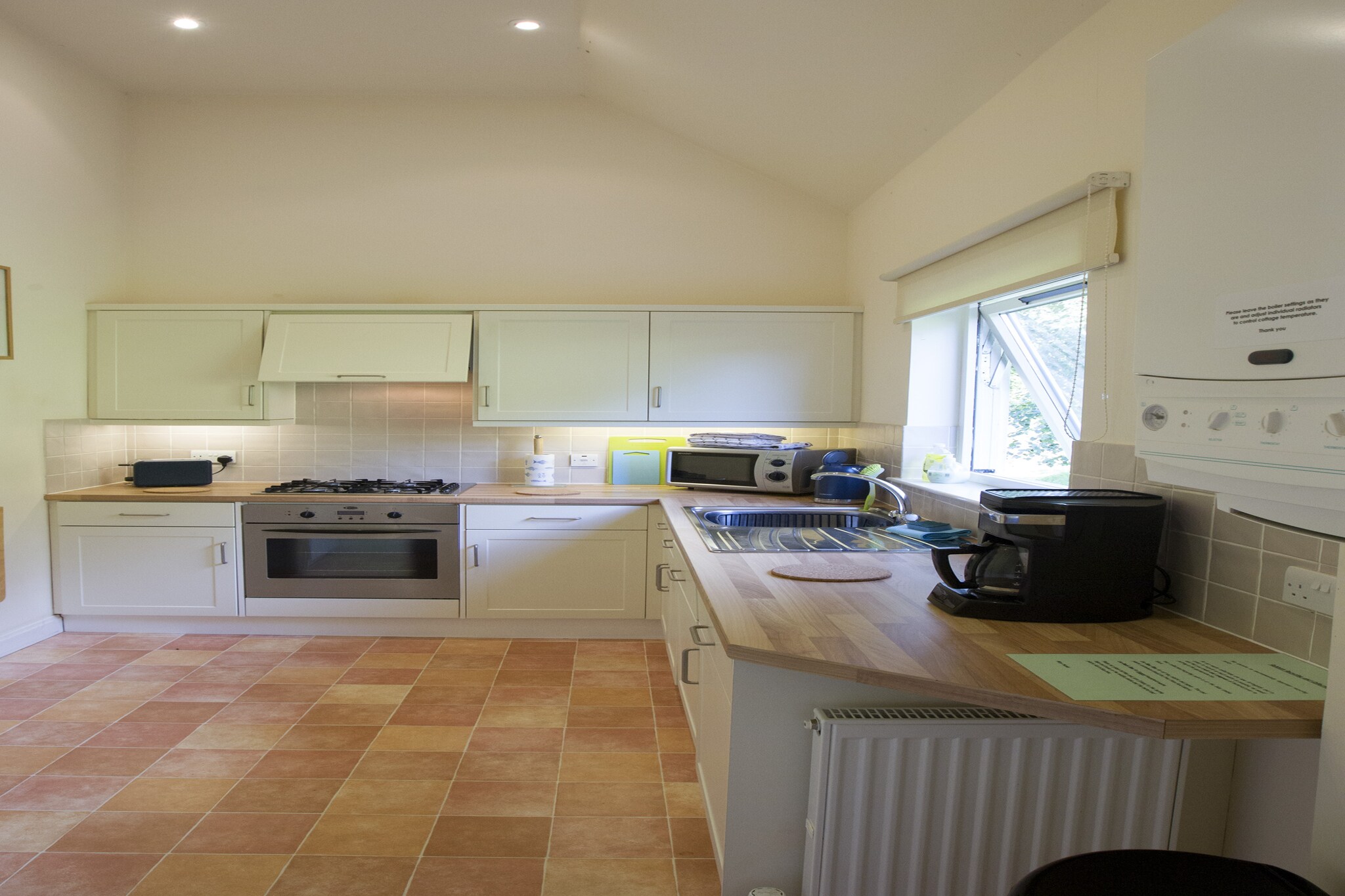 An optional utilities and service fee of GBP 40,00 will be charged before your arrival. Details are given below.<br> Tranquil Border Retreat
Nestled on a sloping hillside, this attractive holiday home offers stunning open views over the Historic Royal Burgh of Jedburgh and the surrounding countryside. Tucked away in a peaceful garden setting yet close to the town centre, the cottage features a modern open-plan design with a split-level kitchen and bathroom. Two comfortable bedrooms - one double and one twin - provide the perfect space for couples or small families. Explore the Borders and Beyond
Jedburgh is a charming town with plenty of bars, cafes, and restaurants all within easy walking distance. Ideal for walking, cycling, and discovering the scenic Border countryside, the location also offers convenient access to famous sites such as Hadrian's Wall, Holy Island, Edinburgh, beautiful beaches, castles, and lochs - all within an hour's drive. Experience the unhurried pace and rich history of the Scottish Borders from this perfectly located base. Comfort and Convenience
The cottage comes with gas central heating, double glazing, free onsite parking, and complimentary WiFi (though speeds may vary due to the rural setting). One well-behaved dog is welcome, with dog towels, treats, and bags provided for your convenience. Guests are asked to respect the property by keeping pets off furniture and supervised at all times, ensuring a comfortable stay for all. <br><b> Optional Utilities & Service Package </b><br><b> An optional utilities and service package of GBP 40,00 </b> can be selected prior to your arrival. You will receive a separate communication with the payment link should you wish to include it.<br>This package ensures a seamless stay and conveniently covers services such as final cleaning, utility consumption, service support, and protection against minor damages or incidental costs during your stay.<br>Guests who prefer may manage these services independently, provided the property is returned in good order at check-out.