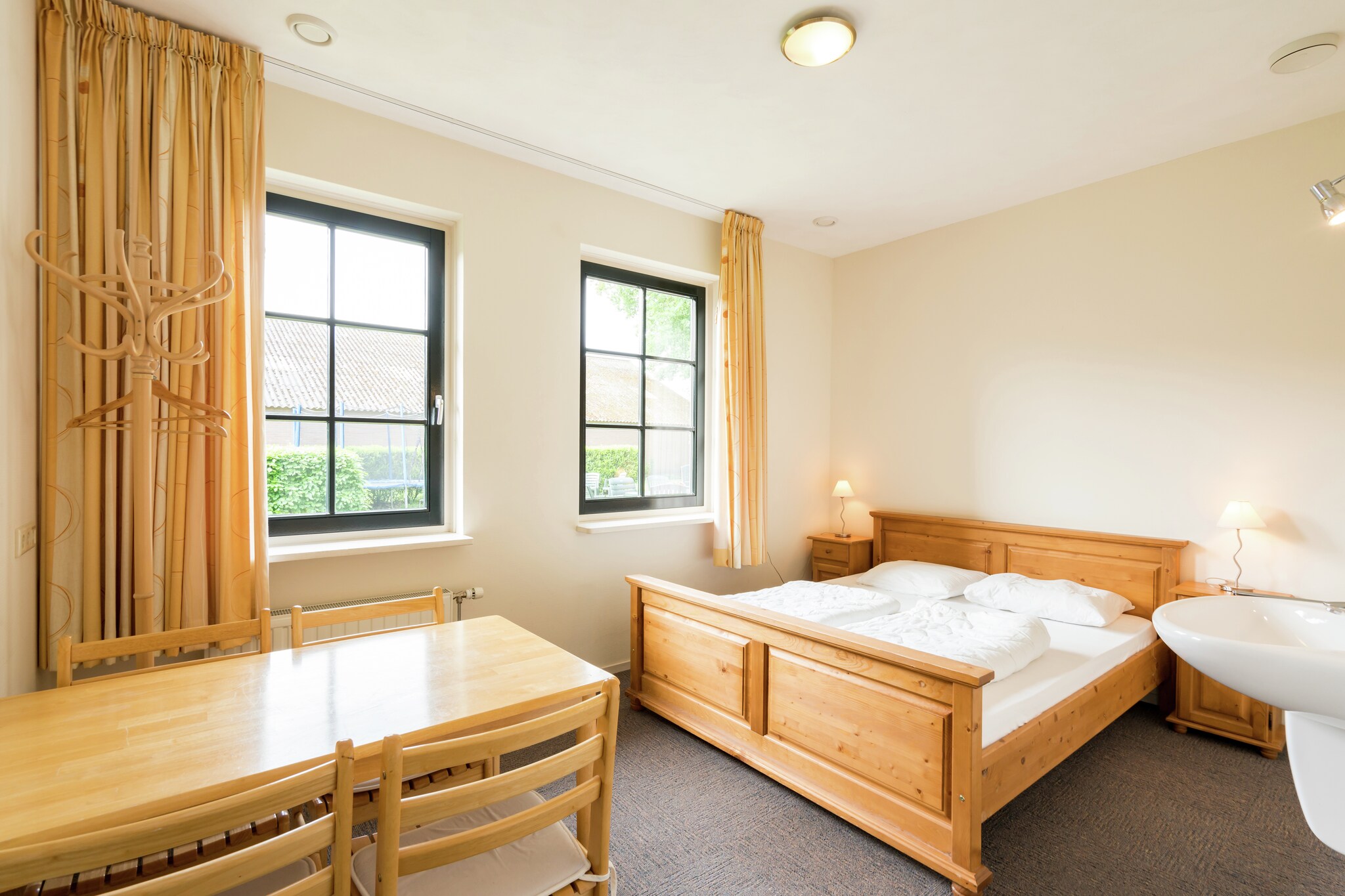 Ground floor: (Living room(TV(satellite), DVD player, stereo unit), open kitchen(coffee machine, combination microwave, dishwasher), bedroom(double bed, washbasin), bedroom(2x single bed, washbasin), bedroom(2x single bed, washbasin), bedroom(2x single bed, washbasin), bathroom(shower(unit), toilet), bathroom(shower), toilet, toilet, storage(tumble dryer, washing machine))\n\nOn the 1st floor: (bedroom(2x single bed, washbasin), bedroom(2x single bed, washbasin), bedroom(2x single bed, washbasin), bedroom(4x single bed, washbasin), bedroom(double bed, washbasin), bathroom(shower), toilet)\n\nheating(central), terrace, garden, garden furniture, sand pit, play equipment, table football, children\'s bed, high chair