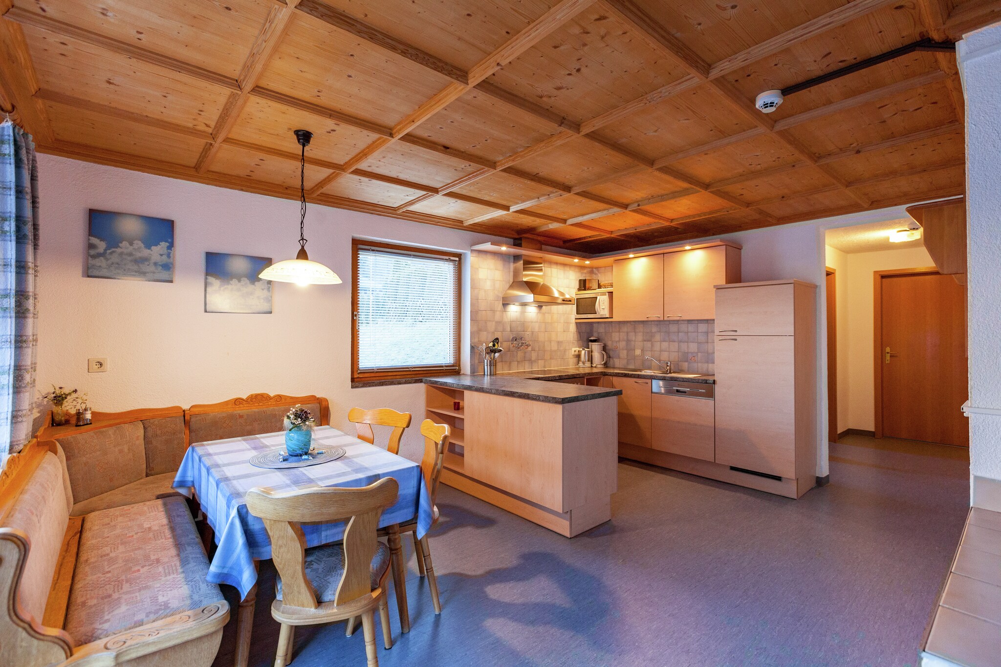 Ground floor: (relaxation area(shared entrance)(shower, solarium, sauna(paid)))\n\nOn the 1st floor: (Living room(seating area), Large kitchen(TV(cable), coffee machine, oven, microwave, fridge-freezer, balcony), bedroom(double bed), bedroom(single bed, single bed, double bed), bathroom(shower), bathroom(washbasin, toilet))\n\nBasement: (ski storage(shared entrance)(washbasin, ski boot heaters))\n\nwashing machine(paid), heating(central), garden(shared with other guests), garden furniture, BBQ, 2x parking, table tennis table, children\'s bed(on request), high chair