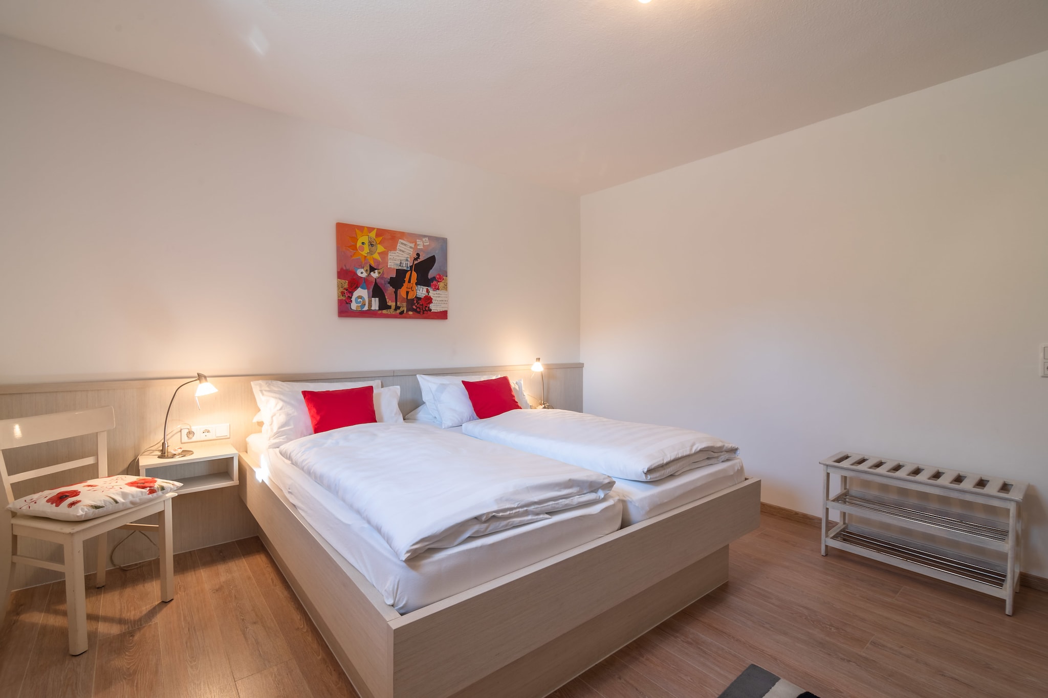 Ground floor: (Entrance, open kitchen(toaster, cooker(4 ring stoves, electric), coffee machine(filter), oven, microwave, dishwasher, fridge(+ freezer)), Living/diningroom(double sofa bed, TV(satellite), stereo unit), bedroom(double bed), bathroom(shower, washbasin, toilet), storage)\n\ncot, washing machine(shared with the owner , paid), heating(central, oil), terrace(private), garden furniture, BBQ(charcoal), parking, deckchairs, parasol, play equipment, high chair, playpen, ironing board, iron