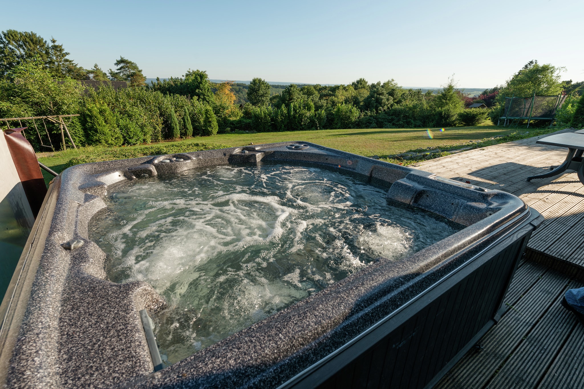 Ground floor: (hallway, hallway, Living room(TV, stove, DVD player), Kitchen(cooker(6 ring stoves, gas), oven, combination microwave, 2x dishwasher, 2x fridge-freezer), bedroom(2x single bed), bedroom(2x single bed), bedroom(2x single bed), bedroom(2x single bed), bedroom(2x single bed), bathroom(shower, washbasin, toilet), bathroom(shower, washbasin, toilet), bathroom(shower, washbasin, toilet), bathroom(shower, washbasin, toilet), bathroom(shower(adapted for disabled), washbasin, toilet(adapted for disabled)), toilet, relaxation area(2x shower, sauna), pantry(tumble dryer, washing machine))\n\nOn the 1st floor: (Sitting room(TV), bedroom(2x single bed, washbasin), bedroom(single bed, double bed), bedroom(single bed, double bed), bathroom(bath tub, shower, 2x washbasin, toilet), bathroom(bath tub, shower, 2x washbasin, toilet))\n\nBubble bath, heating(central), terrace, garden, garden, garden furniture, BBQ, trampoline