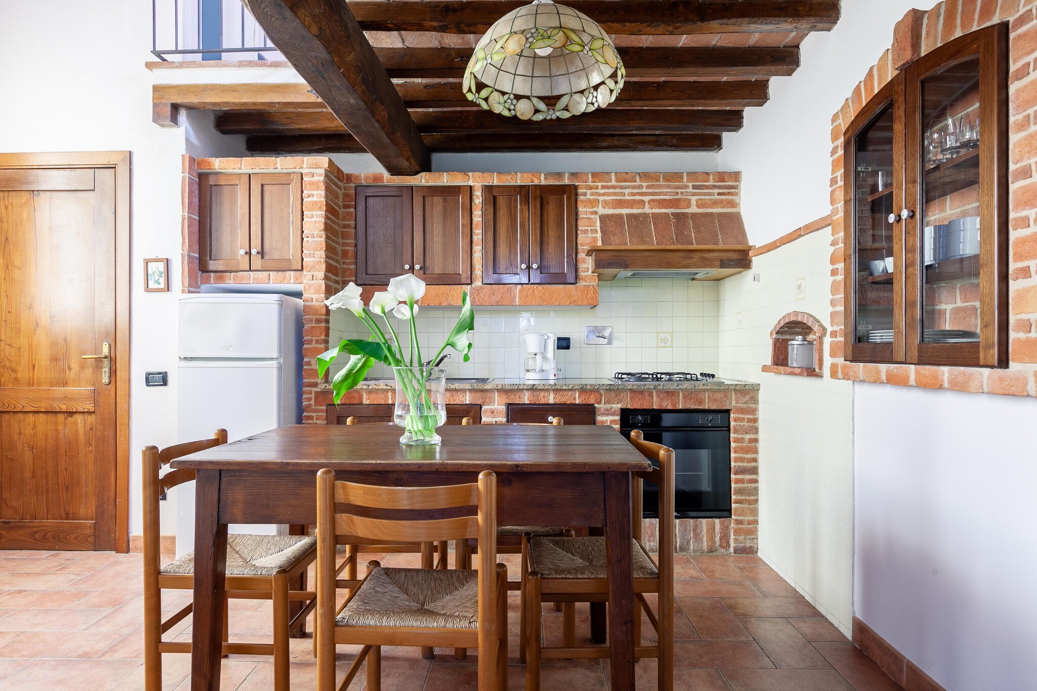 Ground floor: (Living room(seating area), open kitchen(hob, electric kettle, microwave, dishwasher, washbasin), bedroom(double bed), bedroom(double bed), bathroom(shower))\n\nOn the 1st floor: (Living room(double sofa bed))\n\nheating(central), garden, garden furniture, BBQ, swimming pool(shared with other guests, 12 x  6 m.), children\'s bed(on request)