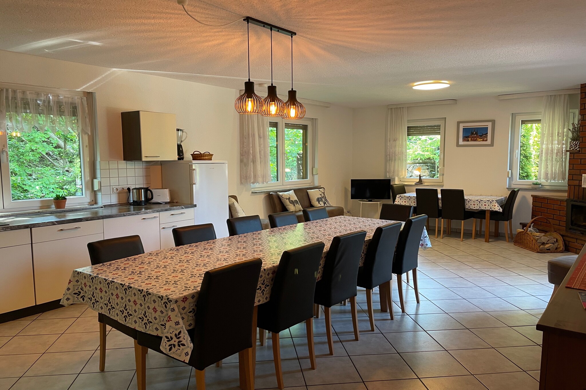 Ground floor: (Entrance, hall, open kitchen(electric kettle, toaster, cooker(4 ring stoves, ceramic), coffee machine, oven, dishwasher, fridge(+ freezer), fridge-freezer), Living/diningroom(TV(flatscreen, satellite), fireplace, stereo unit), bedroom(double bed(160 x 200 cm)), bedroom(single bed(90 x 200 cm), single bed(90 x 200 cm), single bed(90 x 200 cm)), bathroom(bath tub, shower, washbasin, toilet))\n\nOn the 1st floor: (Living room(TV(flatscreen, satellite), stove(solid fuel), stereo unit), bedroom(double bed(160 x 200 cm)), bedroom(double bed(160 x 200 cm)), bedroom(2x single bed(90 x 200 cm)), bathroom(bath tub, shower, washbasin, toilet), bathroom(shower, sauna, washbasin, toilet), Landing)\n\nOn the 2nd floor: (bedroom(2x single bed(90 x 200 cm)), bedroom(2x single bed(90 x 200 cm)))\n\nSitting room, fireplace, sauna(private, 4 persons), balcony, heating(gas, floor heating), 2x terrace(private, 25 m2), garden(private, partially fenced), garden furniture, BBQ, 2x parking, iron