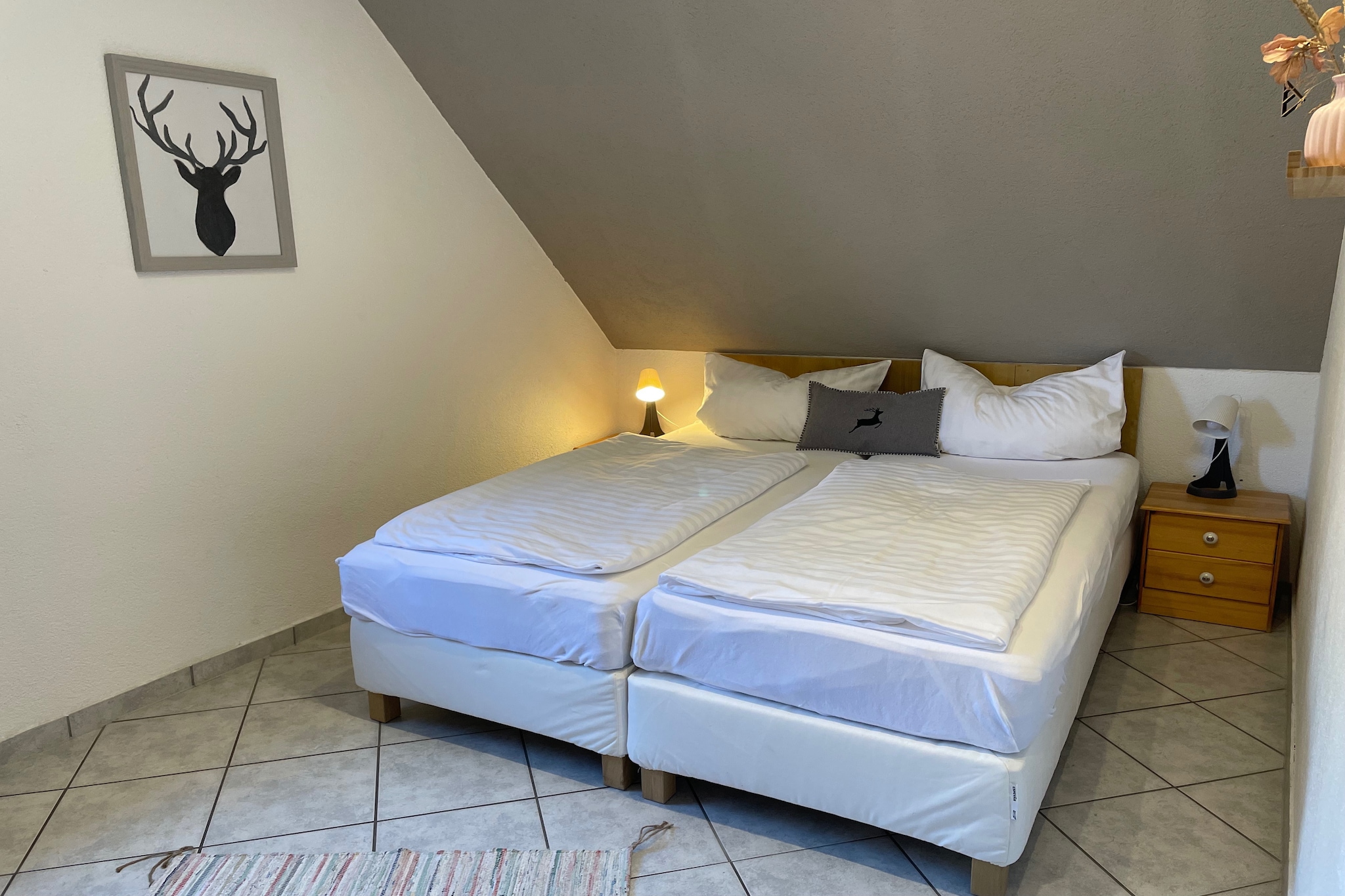 This expansive pet-friendly holiday home in Elend offers a tranquil escape in the heart of the Harz region. Just 1 km from the town center, it’s the perfect base to explore nearby gems like the Brocken summit, Wernigerode Castle, and the Elendstal nature reserve. For history buffs, the Sorge Border Museum and the Kleinste Holzkirche Deutschlands add cultural charm, while outdoor enthusiasts will love hiking Barenberg or visiting the Schnarcherklippen rock formations.
Spread across three floors, the property features seven bedrooms, three bathrooms, and multiple living areas with satellite TVs and fireplaces. The open kitchen is fully equipped with ceramic stove, oven, dishwasher, and fridge-freezer. Guests can unwind in the private sauna, enjoy meals on two terraces, or relax in the garden with barbecue facilities. Central gas and floor heating, a balcony, and two parking spaces ensure comfort and convenience for large families or groups.
Surrounded by forest trails and just steps from public transport and bike rentals, the location is ideal for year-round adventure. Dining options nearby include the cozy Waldbad-Schenke, the hearty Restaurant Zum Berg - Quell Stübchen, and the rustic Zum Steinofen.