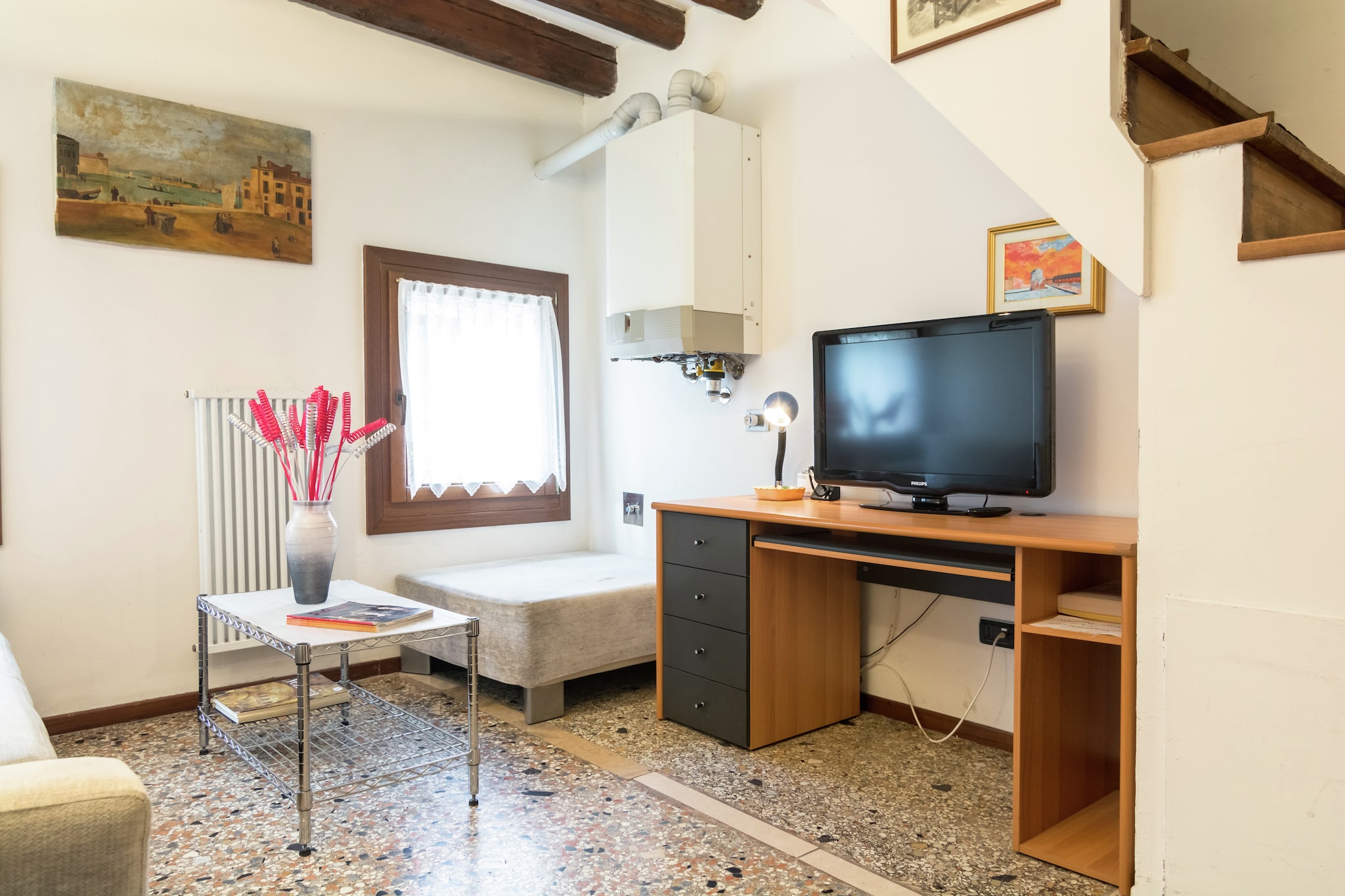 Located in the heart of old town of Venice, this cosy apartment offers 2 bedrooms for 4. Ideal for a family, it has central heating and air conditioning apart from comfortable amenities and close proximity to the sea.



You can walk around the town centre, which hardly 100 m away and enjoy the buzz. Essentials can be bought from the stores, 1 km away. The sea is just 5 km away, where you can go to sunbathe or enjoy water activities.



The traditional style living room and views of colourful rooftops will delight you. You can stay comfortable as it has air conditioned (and heated). Parking facility is available at local rates. A well-equipped kitchen lets you cook as you wish. There is washing machine to keep your laundry worries at bay.



Public transport is available just 500 m away.

