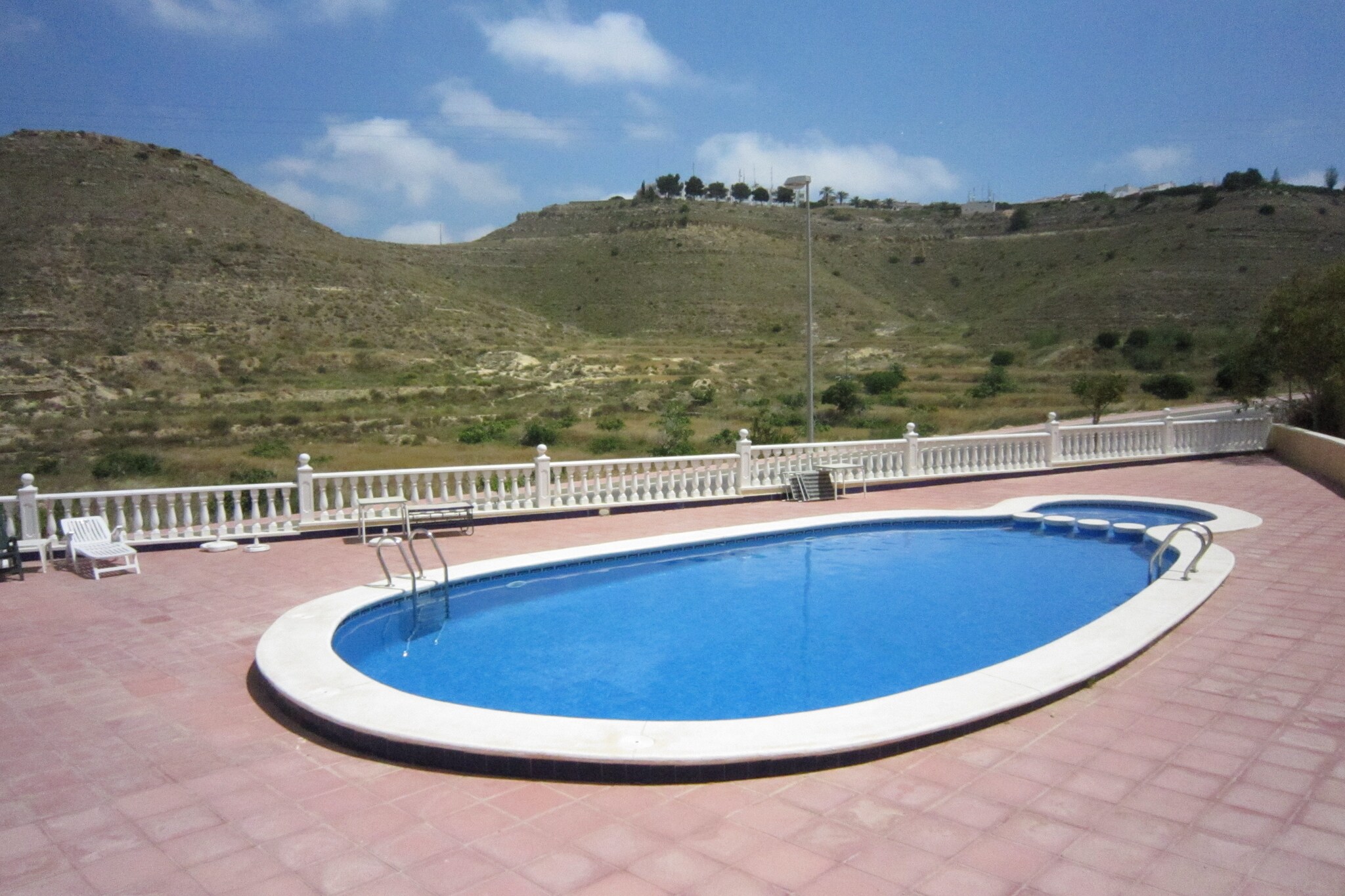 Ground floor: (open kitchen(cooker(ceramic), combination microwave, fridge-freezer, washing machine), Living/diningroom(TV(satellite, dutch television channels), garden doors, air conditioning), bedroom(double bed, air conditioning), bathroom(shower, washbasin, toilet))\n\nBasement: (bedroom(3-person bunk bed), bathroom(shower, washbasin, toilet))\n\nbalcony, terrace(private), garden furniture, swimming pool(shared with other guests)