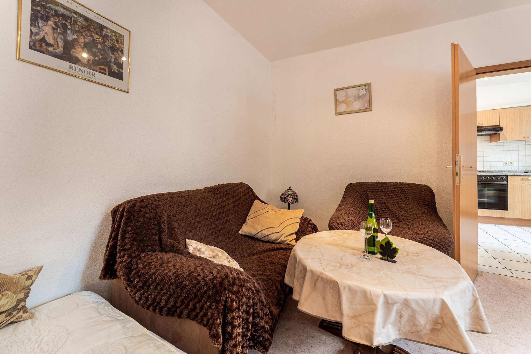 Located just 150 m from the river in the historic town of Ediger-Eller, this cozy 2-bedroom apartment offers a warm welcome to families of up to five. The first-floor unit features a comfortable living room, a well-equipped kitchen, and access to WLAN throughout. Free riverside parking is available just 100 m away, and the apartment can be combined with the ground-floor unit (DE-56814-09) for larger groups.

Explore the Moselle Valley 
The Moselle boat dock is only a two-minute walk away, perfect for scenic cruises. The Moselle Cycle Path winds through romantic villages and vineyards, with highlights like Cochem Castle and the award-winning Historic Mustard Mill just 15 km away. The mill offers guided tours and tastings of gourmet mustards made from centuries-old recipes2. There is a bakery at 100 m distance from where you can enjoy sweets and desserts.

Local Fun & Family Activities 
The Ediger-Eller Tourist Office organizes seasonal events and activities for all ages, from wine festivals to guided hikes along the Calmont Klettersteig, Europeâ€™s steepest vineyard trail. Whether you're cycling, cruising, or simply relaxing, this centrally located apartment is a perfect base for your Moselle adventure.