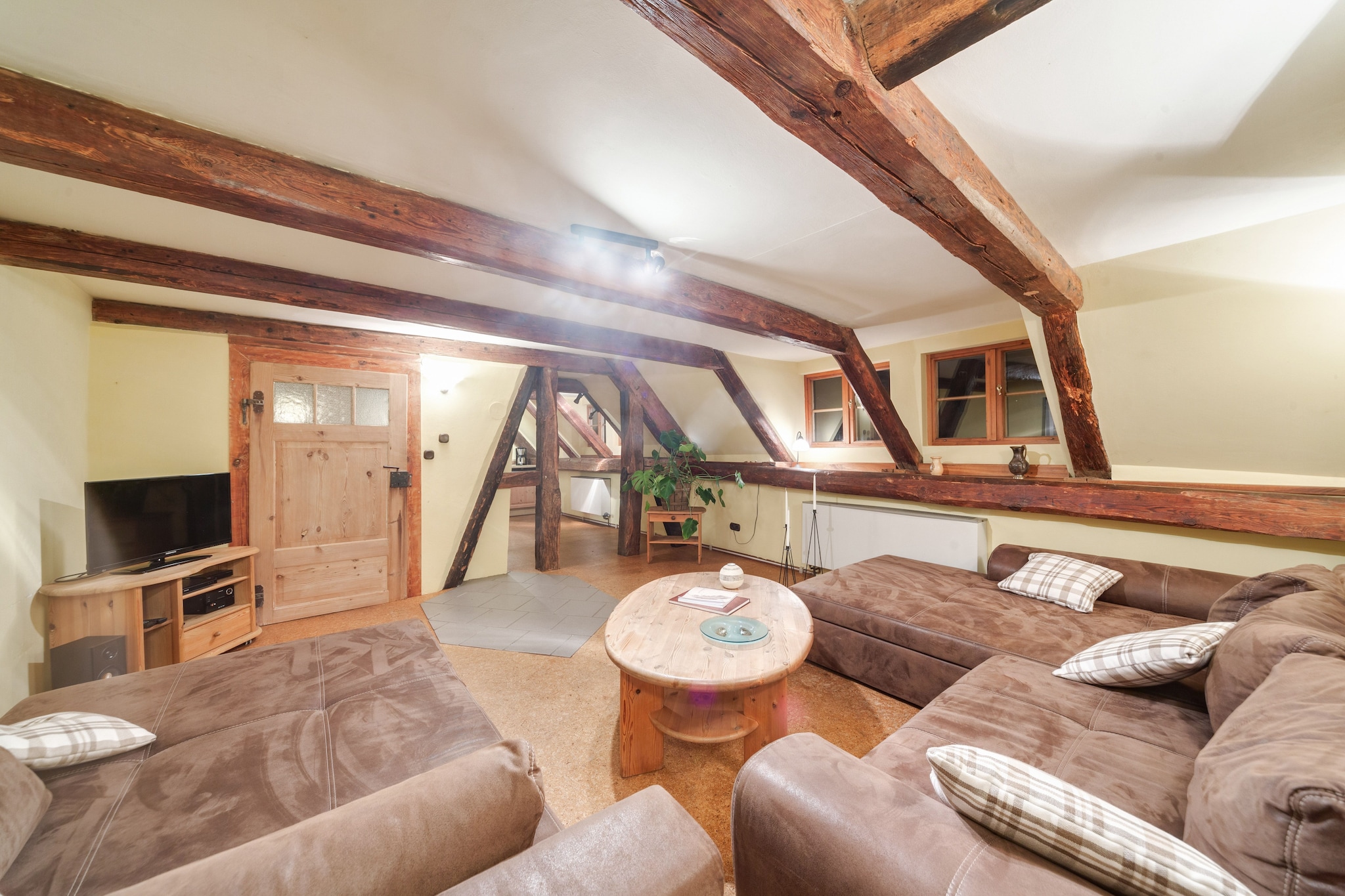 This generously sized, pet-friendly apartment spans two floors and is ideal for large families or groups seeking a countryside escape. The ground floor features a bright living/dining area with two double sofa beds, TV, DVD and CD players, stereo unit, and garden doors leading outside. The open kitchen is fully equipped with a cooker, oven, dishwasher, and fridge-freezer, while the bathroom includes a shower and toilet. Play equipment, a children’s bed, and a high chair make it especially family-friendly.
Upstairs, guests will find a second living room with two single sofa beds and entertainment amenities, plus a dining room with a decorative fireplace. Sleeping arrangements include a bunk bed, a double sofa bed, and a children’s bedroom with multiple beds and play equipment. The second bathroom offers a hip bath, shower, toilet, washbasin, and urinal. A washing machine is available, and central heating ensures comfort year-round.
Outdoors, enjoy a private courtyard and shared garden with furniture, BBQ, and play equipment. Table football and stables add to the charm, while nearby forest trails, lakes, and rivers offer plenty of nature-based activities. Shops, restaurants, and public transport are within 3.5 km, and the train station is just 13 km away.