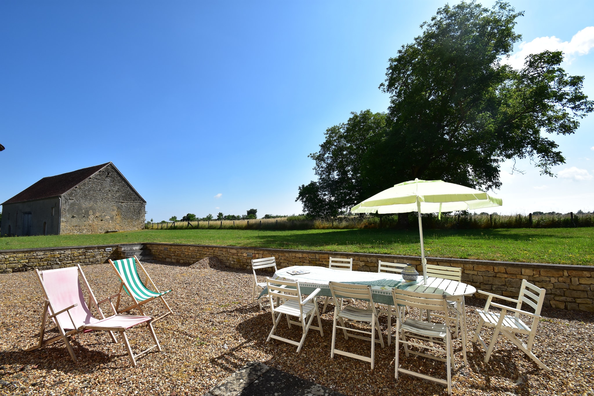 Located in Burgundy, this mansion is a renovated 17th-century manor house and has 4 bedrooms to accommodate 8 people. The property is ideal for many families travelling together or a group of friends and features a garden, a private courtyard, and a barbecue facility.

 The town centre of Prémery is 11 km away, where all the shops, cafes and restaurants are located. While local delicacies can be savoured at restaurants 5 km away, supermarkets at 11 km will be a great place to get different products. Nightlife can also be enjoyed 11 km away. Morvan Natural Park is also close by where you can relax by the lakes and enjoy delicious local food. 

Enjoy fun conversations with family/friends near the fireplace or while grilling barbecue food. There is a private courtyard and a garden apart from a table tennis table and billiards, where you can have fun.
