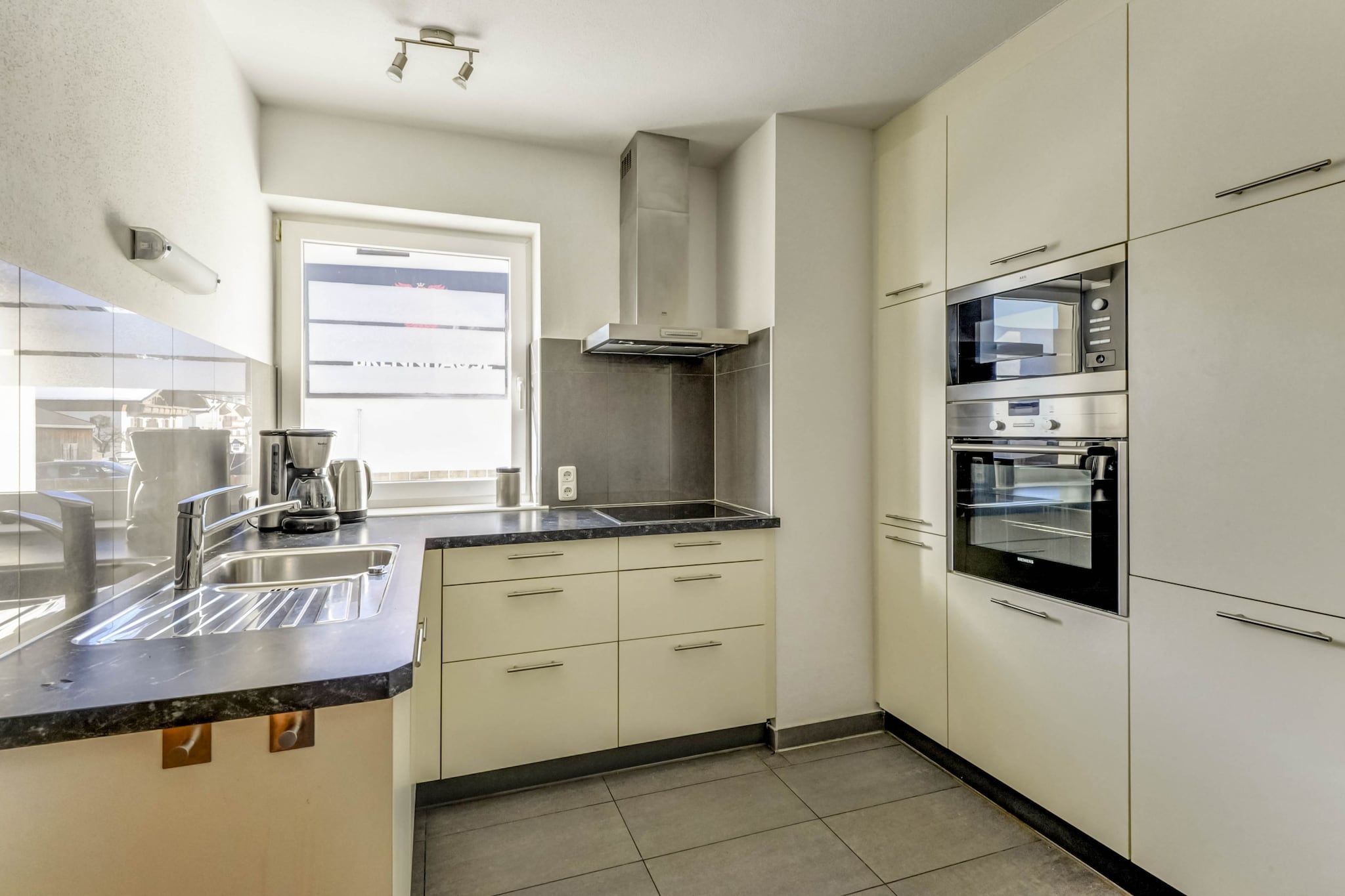 Ground floor: (Living room(TV(satellite), dining table, fireplace, stove(wood), radio, stereo unit, garden doors, terrace, garden furniture), Kitchen(oven, microwave, dishwasher, fridge-freezer), toilet(washbasin, toilet))\n\nOn the 1st floor: (bedroom(single bed, double bed, balcony), bedroom(double bed, TV(satellite)), bedroom(double bed, balcony, children\'s bed), walk-through bedroom(single bed, balcony), bathroom(bath tub, shower, 2x washbasin), toilet(washbasin, toilet))\n\nBasement: \n\nski storage(2x camping cot), heating(central), heating(central, floor heating), terrace(private, fenced), garden(private, fenced), garden furniture, parking, bicycles available, 3x high chair