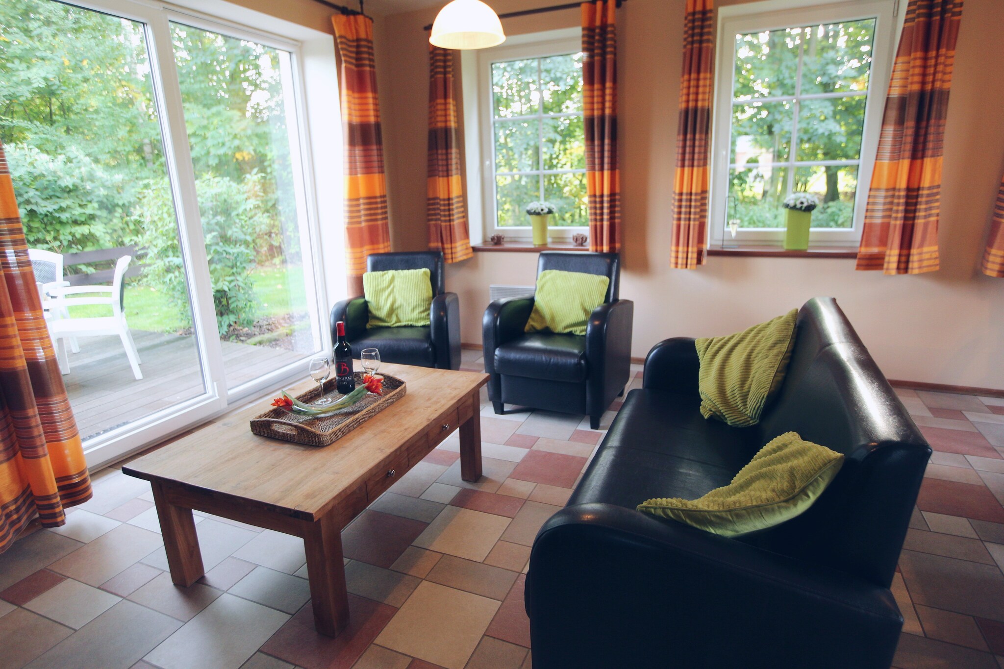 Ground floor: (Living room(TV(flatscreen, satellite, international television channels), dining table(8 persons), stove(wood), seating area, DVD player, garden doors), open kitchen(electric kettle, cooker(4 ring stoves, ceramic), hood, coffee machine, oven, microwave, dishwasher, fridge-freezer), bathroom(shower, sauna, washbasin), toilet)\n\nOn the 1st floor: (bedroom(double bed(twin duvet)), bedroom(2x single bed(duvet)), bedroom(2x single bed(duvet), bunk bed), bathroom(bath tub, shower, washbasin, toilet))\n\nrecreation room(table tennis table(shared with other guests), table football(shared with other guests), billiards), terrace(private), garden(private), garden furniture, BBQ, parking, trampoline, swimming pool(shared with other guests, heatable, 8 x 4 m.), sand pit(shared with other guests), play equipment(shared with other guests), slide(shared with other guests), football goal(shared with other guests), high chair