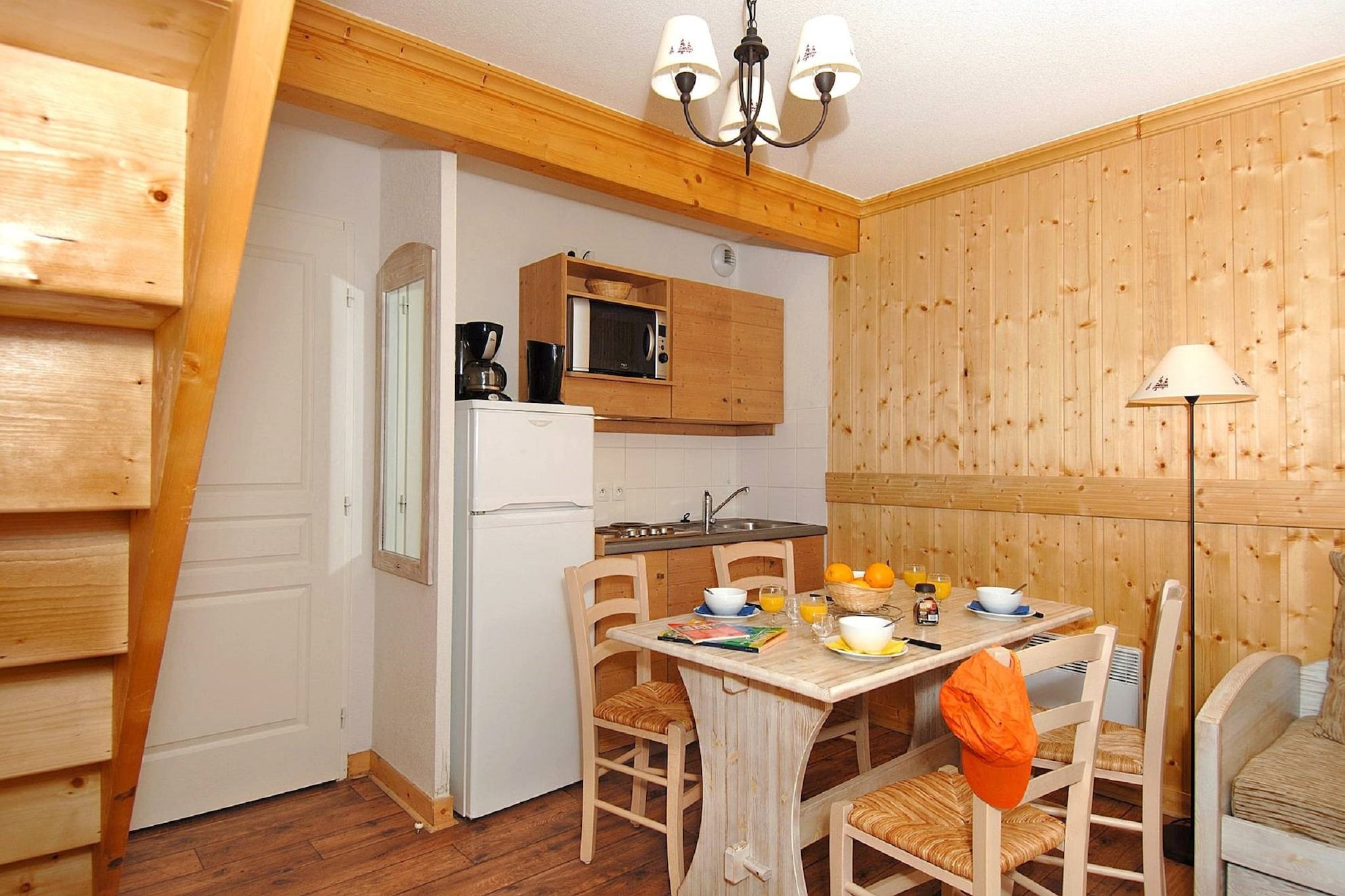 Alpine Chalet Comfort
Set within the scenic holiday park of Les Chalets de L’Arvan II, this apartment combines traditional Savoyard charm with modern comfort. Natural wood and stone details create a warm alpine atmosphere, while the living area invites relaxation with a sofa bed, TV, and direct access to a private terrace or balcony. The fully equipped kitchenette makes dining in easy, whether you’re preparing a hearty breakfast before the slopes or enjoying an evening meal together.

Prime Mountain Location
Located in St. Sorlin d’Arves, the chalet is perfectly positioned to enjoy the Northern Alps year-round. In winter, the ski runs are within easy reach for endless days on the slopes, while warmer months bring opportunities for hiking, cycling, and breathtaking alpine views. The village is just a short stroll away, offering bakeries, cafés, and markets where you can sample regional cheeses, charcuterie, and freshly baked bread.

Pet-Friendly Adventures
Traveling with pets? This stay welcomes them, and the area offers plenty of outdoor activities you can enjoy together. Explore scenic walking trails that wind through mountain pastures, stop at dog-friendly terraces for a break, or simply let your companion play in the fresh alpine air. After a day of exploration, unwind back at your apartment, where the terrace provides the perfect spot to enjoy the mountain sunset with your four-legged friend by your side.