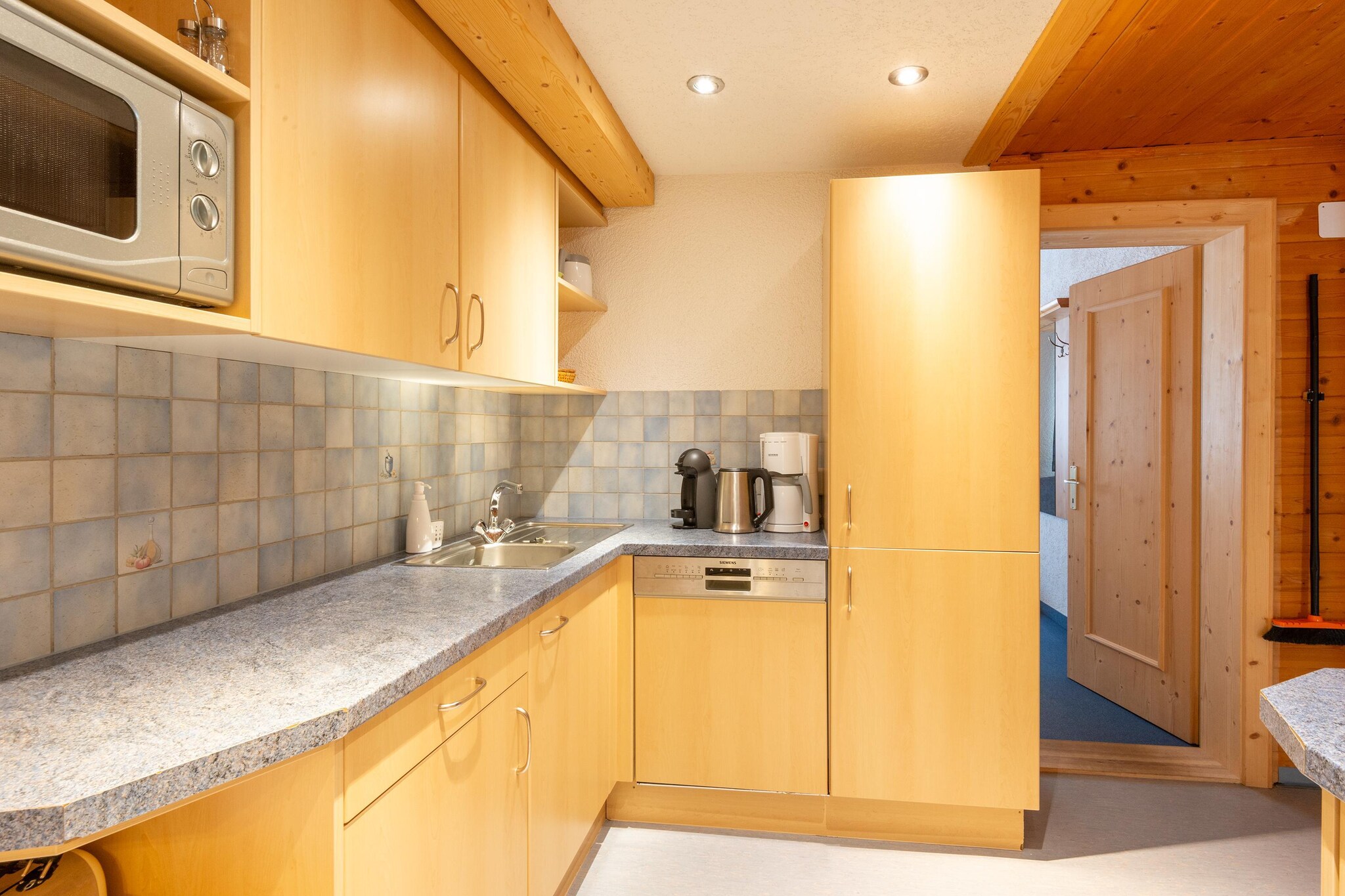 Ground floor: (relaxation area(shared entrance)(shower, solarium, sauna(paid)))\n\nOn the 2nd floor: (open kitchen(cooker(ceramic), oven, microwave, dishwasher, fridge-freezer), Living/diningroom(TV(cable), balcony), bedroom(double bed), bedroom(double bed), bedroom(single bed, double bed), bedroom(single bed, double bed, washbasin), bedroom(double bed), bathroom(shower, washbasin, toilet), bathroom(shower, washbasin, toilet), bathroom(shower, toilet))\n\nBasement: (ski storage(shared entrance)(washbasin, washing machine(shared with other guests, paid), ski boot heaters))\n\nheating(central), garden(shared with other guests), garden furniture, BBQ, 5x parking, play equipment, table tennis table, children\'s bed(on request), high chair