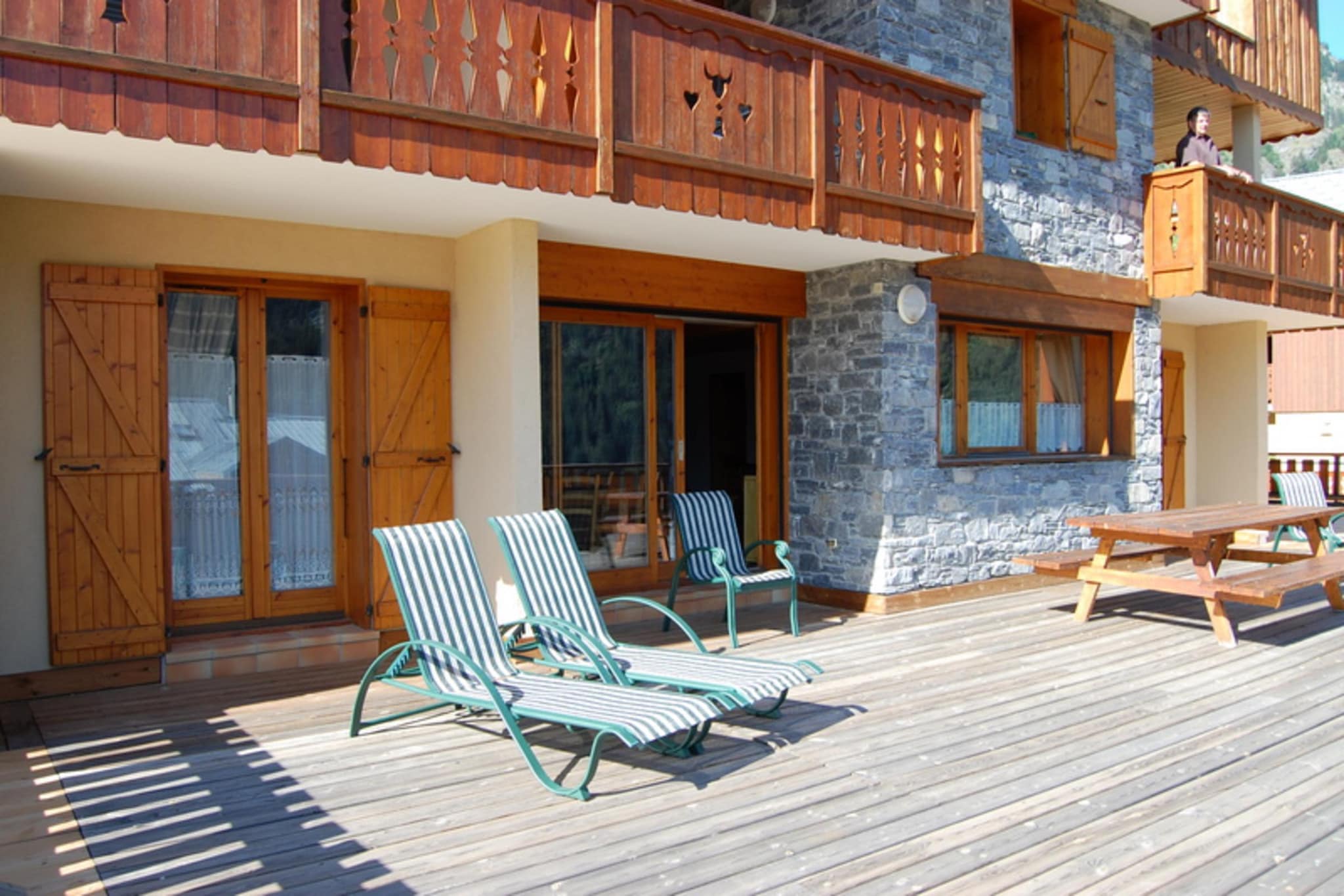 Located near the ski area in Champagny-en-Vanoise, this apartment comes with 7 bedrooms to host 15 people. It is ideal for a large group or families to stay.The balcony gives magnificent views of the Courchevel valley and the electric heating gives a cozy stay.You can spend your day skiing at Paradiski ski area. There are also activities like golf or climbing or paragliding to try. You can dine out at 50 m and finish your shopping at 300 m.This spacious south-facing terrace with furniture is ideal for a relaxing time with friends and family. The modern kitchen, living room, spacious bedrooms, and electric heating makes the home comfortable. Cot, high chair and free WiFi are also provided.