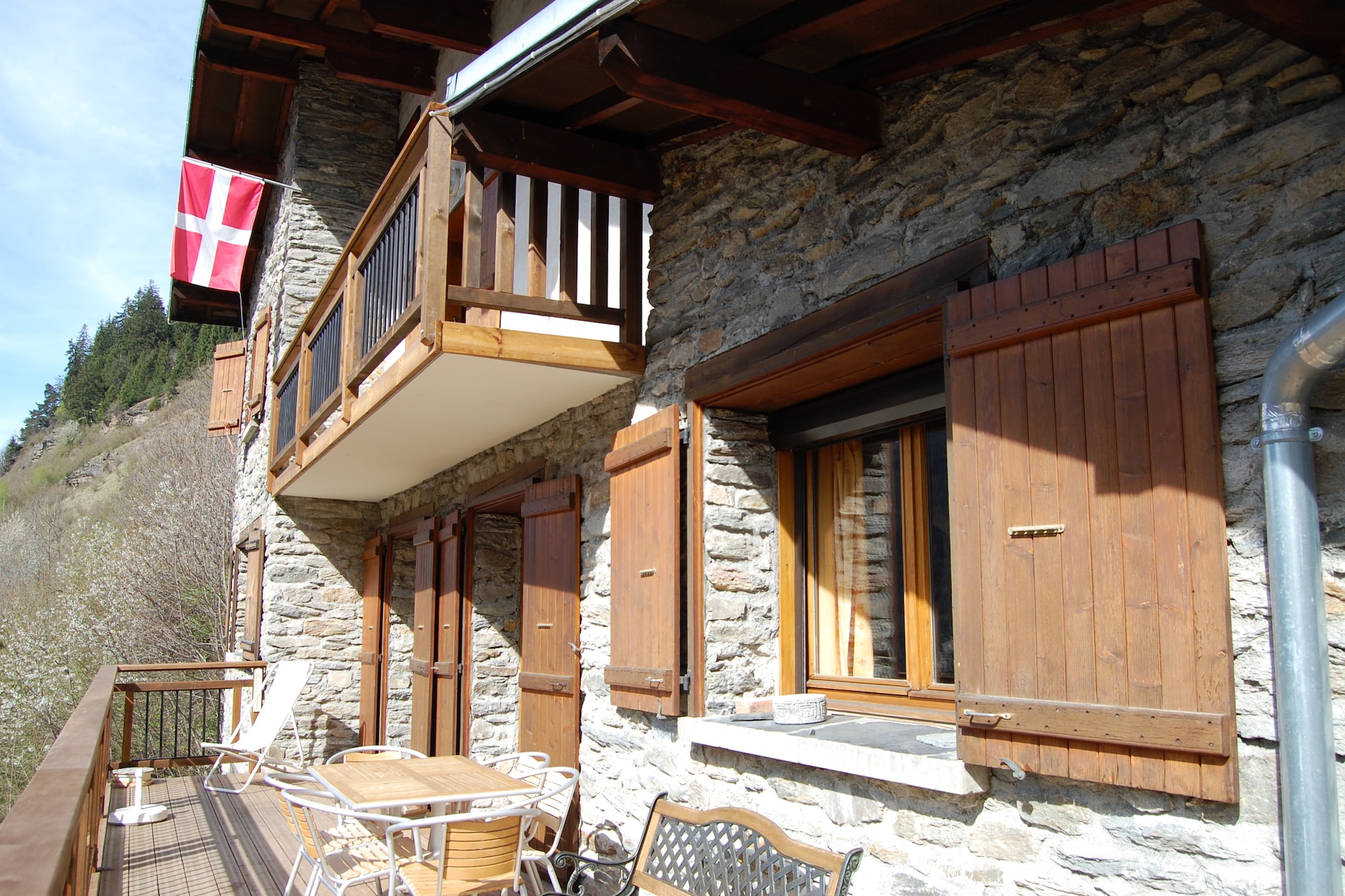With breathtaking views of the Vanoise and Courchevel glaciers, this 8-bedroom chalet in Champagny-en-Vanoise is a perfect pick for families. With a capacity to sleep 15 guests, it features sauna and balcony, so that you can warm up and refresh with gorgeous views.
This beautiful detached chalet with a fantastic view of the Vanoise and Courchevel glaciers is located 1 km from the cozy and authentic center of Champagny-en-Vanoise. The chalet is on the road to Bozel and close to the Champagny-Les-Rochers area. The cable car that takes you to the Paradiski ski area (La Plagne - Les Arcs) is about 1 km away. In summer you can go on endless, wonderful hikes, mountain bike tours, racing bike tours or simply enjoy the area in the sunny garden. The area is known for the numerous slopes where ambitious cyclists can let off steam. The Tour de France also comes by frequently in July. In Bozel (4.5 km) there is also a cozy bathing lake with many activities on the shore. You can also spend an afternoon golfing or rock climbing. Rafting is recommended for adventurers.
The Chalet du Torchet has a large entrance hall with a ski boot rack and a small sofa on the ground floor. You also have a large garage (handy for your bicycles and/or motorbikes!) and a wine cellar. After a great day on the slopes, you can warm up by the fireplace or quickly enjoy the view from the south-facing balcony.
About Belvilla
When you stay in a Belvilla home, you can rest assured of a unique holiday home in ideal surroundings at an attractive price. The portfolio of accommodations consists of more than 40,000-holiday homes in 20 European countries. Interested in a weekend getaway, a summer or winter sports holiday or simply a short break? Do you prefer the coast, the countryside or the mountains? Whatever your preference, there is a Belvilla home to meet your needs, from a cosy gîte for two to a castle big enough for the entire family, from an apartment in the heart of Rome to a cabin in the middle of nowhere, from a simple tree house to a luxury dream villa and from close to home to the other side of Europe.
A Belvilla home gives you the freedom to enjoy breakfast in your pyjamas or continue a good conversation into the morning hours without having to worry about the bar's closing time. Prepare gourmet meals with fresh local ingredients in your own kitchen and take advantage of having your own swimming pool to do as many cannonballs as you want! In other words, you can enjoy complete privacy in your home away from home.