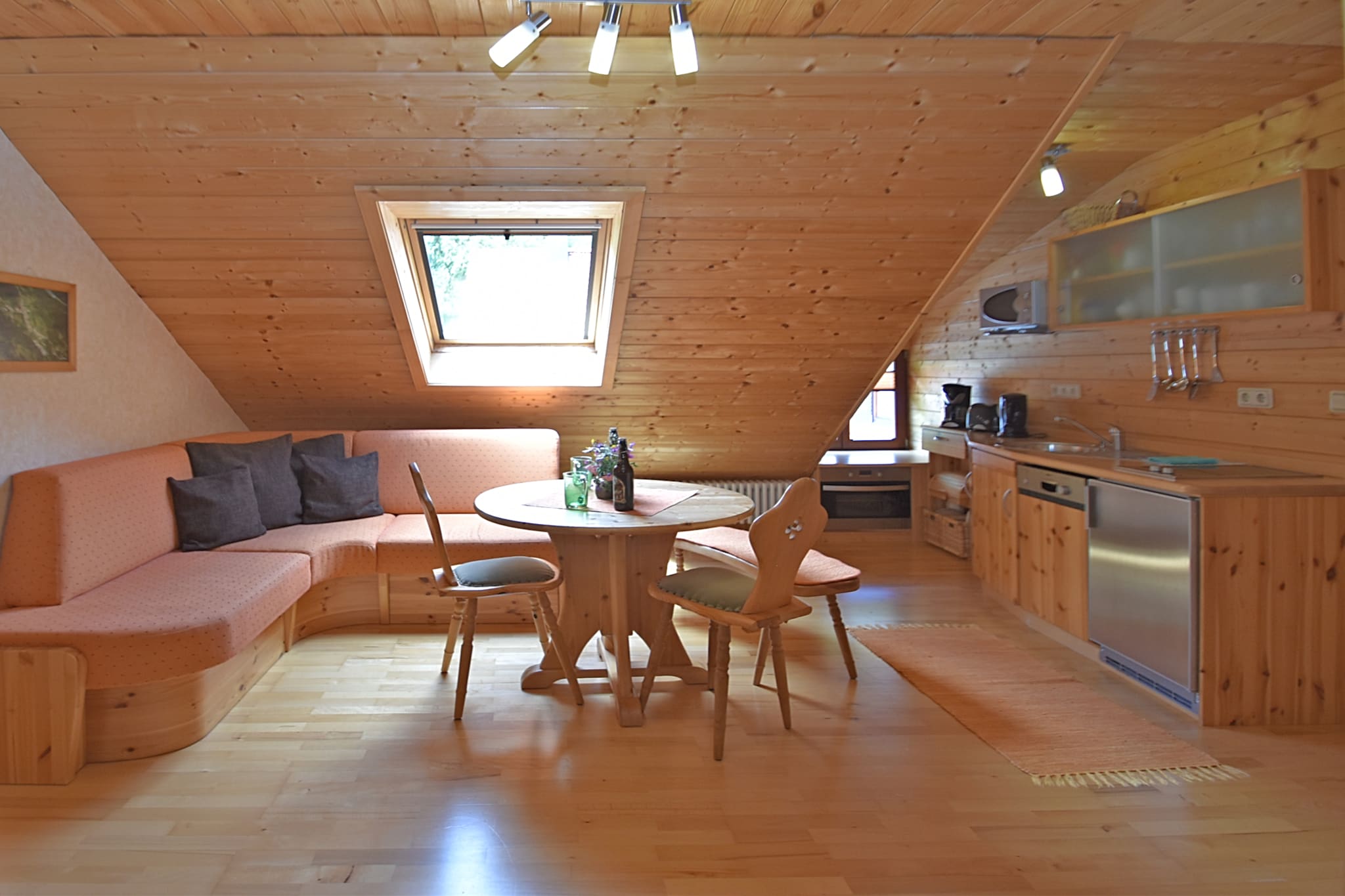 Nestled in the peaceful village of Langenbach, this 2-bedroom farmhouse offers a cozy retreat for small families or groups. The first-floor home features a well-equipped open kitchen, a bright living and dining area with a TV, and a modern bathroom. Step outside to the private terrace or relax in the shared garden with deckchairs, perfect for sunbathing or enjoying fresh air after a day of exploring. Parking is available on the property for convenience.

The surrounding region is ideal for outdoor enthusiasts, with numerous walking and hiking routes right from the village. Adventure lovers can access a ski lift just 12 km away, while cultural excursions to Vessra Monastery (18 km), Fort Coburg (30 km), Erfurt (72 km), and historic Weimar (80 km) make memorable day trips. This location combines tranquility with easy access to both natural beauty and regional attractions.

Local restaurants and supermarkets are just 3 km away, offering convenient options for meals and supplies. At home, you can enjoy family meals around the dining table, host a barbecue on the terrace, or simply unwind in the shared garden. With central heating, a cot and high chair ready for young children, and comfortable indoor and outdoor spaces, this farmhouse provides a balanced mix of relaxation and activity in the heart of the Thuringian Forest.