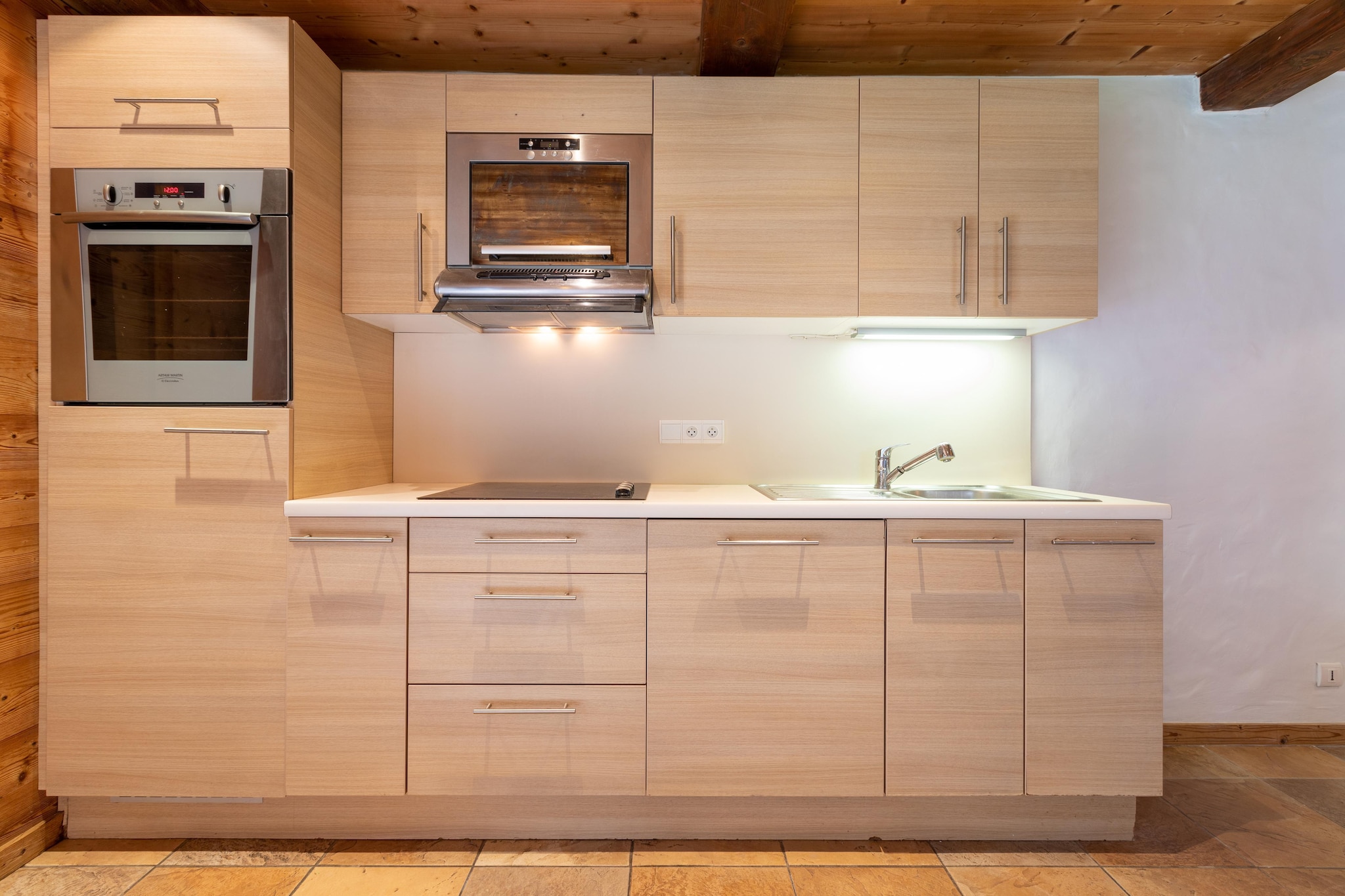 Ground floor: (dining room, open kitchen(electric kettle, cooker(ceramic), hood, coffee machine(espresso), oven, microwave, dishwasher), Living/bed room(double sofa bed, TV(smart TV), DVD player), bedroom(2x single bed(90 x 200 cm)), bedroom(2x single bed), bathroom(shower, washbasin), toilet, ski storage)\n\nwashing machine, ski boot heaters, heating(electric, floor heating), terrace, garden, garden furniture, parking