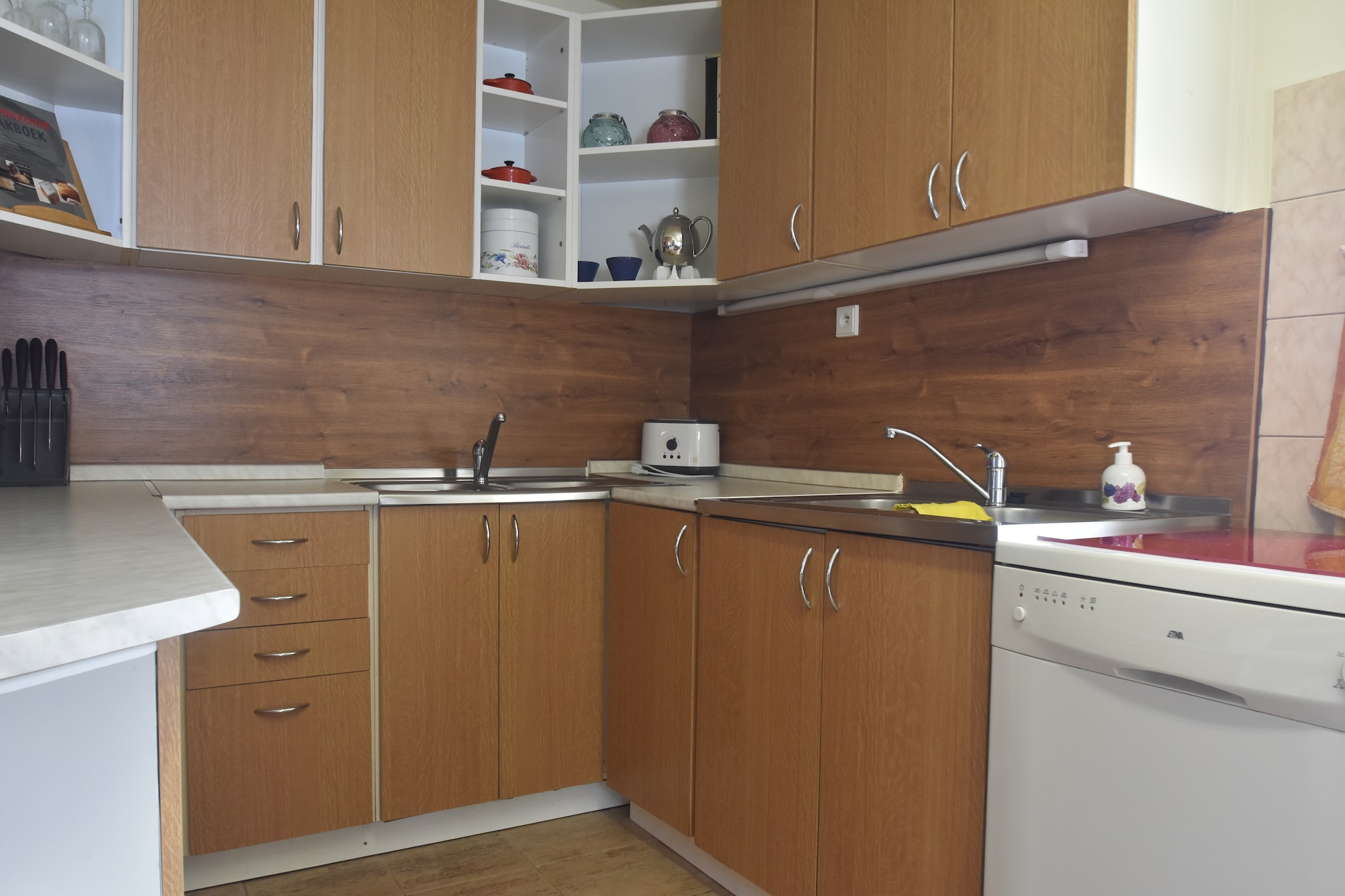 Ground floor: (hallway, dining room(dining table(10 persons), stove(wood), high chair), Kitchen(electric kettle, toaster, cooker(gas), coffee machine, oven, grill, microwave, dishwasher, fridge-freezer), bedroom(2x single bed), bedroom(2x single bed(duvet)), bathroom(2x shower, 2x washbasin, toilet, urinal), bathroom(2x shower, washbasin, toilet), infrared sauna)\n\nOn the 1st floor: (Living room(48 m2)(TV(satellite, dutch television channels, german television channels), dining table(4 persons), stove(tiled), seating area, DVD player, stereo unit), bedroom(2x single bed(duvet), children\'s bed), bedroom(2x single bed(duvet)), bedroom(single bed(duvet), bunk bed(duvet)), bathroom(2x washbasin, 2x toilet), Landing(table football))\n\nwashing machine, heating(central), terrace(roofed), garden(private, > 1000 m2), garden furniture, BBQ, trampoline, deckchairs, swimming pool(private,  8 x  3 m., opened from May upto and including Sep), play equipment