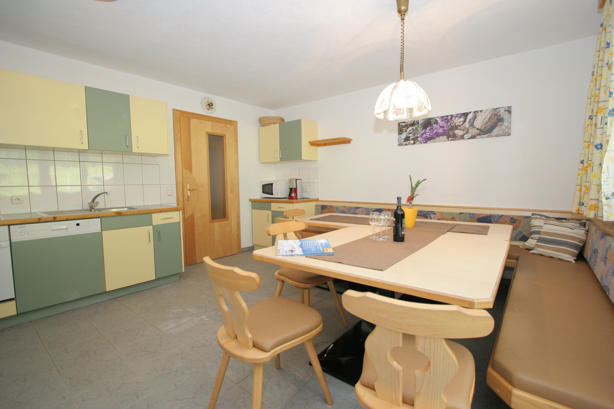 Ground floor: (hallway, open kitchen(oven, microwave, dishwasher, fridge-freezer), bedroom(single bed, double bed), bedroom(double bed), bedroom(double bed), bedroom(double sofa bed, TV), bathroom(bath tub, shower, washbasin), bathroom(shower, washbasin), bathroom(washbasin, toilet), bathroom(washbasin, toilet))\n\nOn the 1st floor: (Large kitchen(TV(satellite), oven, dishwasher, fridge-freezer), bedroom(single bed, double bed), bedroom(single bed, double bed), bedroom(double bed), bedroom(double bed), bathroom(bathtub with shower, washbasin), bathroom(shower, washbasin), bathroom(shower, washbasin), bathroom(washbasin, toilet), bathroom(washbasin, toilet))\n\nwashing machine, ski boot heaters, balcony, garden, garden furniture, parking, play equipment, children\'s bed, high chair