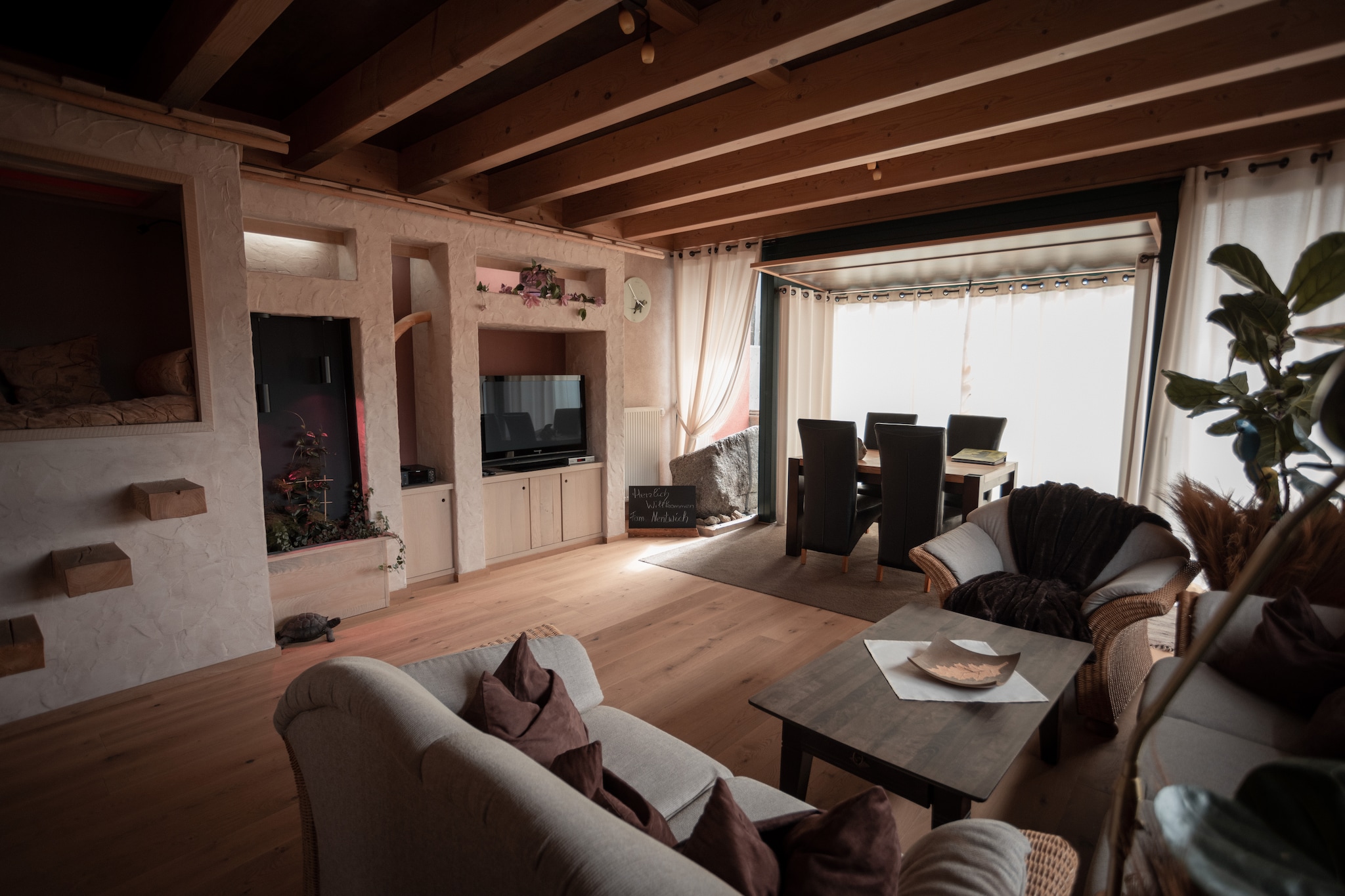 This charming multi-level holiday home in Viechtach offers a peaceful escape for families or small groups. It features three spacious bedrooms, including a gallery-style sleeping area, a modern bathroom with shower, and a cozy living/dining room with satellite TV, DVD player, and stereo system. The fully equipped kitchen includes a ceramic stove, oven, microwave, dishwasher, and fridge-freezer. A private terrace, balcony, and garden with barbecue and furniture provide space to relax outdoors.

Guests enjoy thoughtful amenities such as central heating, a sauna, shared laundry facilities, a childrenâ€™s bed, high chair, and bicycle storage. The layout is ideal for comfort and convenience, with deckchairs, a parasol, and private parking.

Nearby, explore the dazzling Kristallmuseum Viechtach, stroll through the artistic GlÃ¤serne Scheune, or hike to the scenic ruins of Burg NeunuÃŸberg. Nature lovers will enjoy Bayerisch Kanada, a forested area with river trails. For dining, try Blossersberger Keller for Bavarian classics, Adventure Camp SchnitzmÃ¼hle for Thai-German fusion, or SchÃ¼tzenhaus for hearty regional fare. With ski slopes just 14 km away, this retreat is a perfect base for your Bavarian adventure.