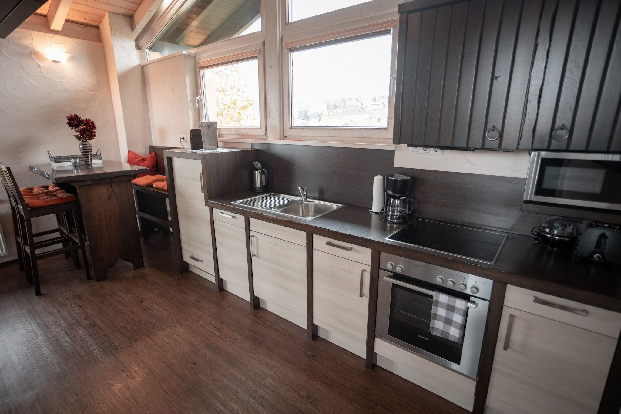 Ground floor: (Kitchen(dining table, electric kettle, toaster, cooker(4 ring stoves, ceramic), coffee machine(filter), oven, microwave, dishwasher, fridge-freezer), Living/bed room(double bed(180 x 200 cm), TV(flatscreen, satellite), fireplace, stereo unit, Bubble bath, shower, infrared sauna), Gallery bedroom(double king size bed), bathroom(washbasin, toilet))\n\nwashing machine(shared with other guests), heating(central), terrace(private), garden, bicycle storage, garden furniture, BBQ(charcoal), parking, deckchairs, parasol, children\'s bed, high chair