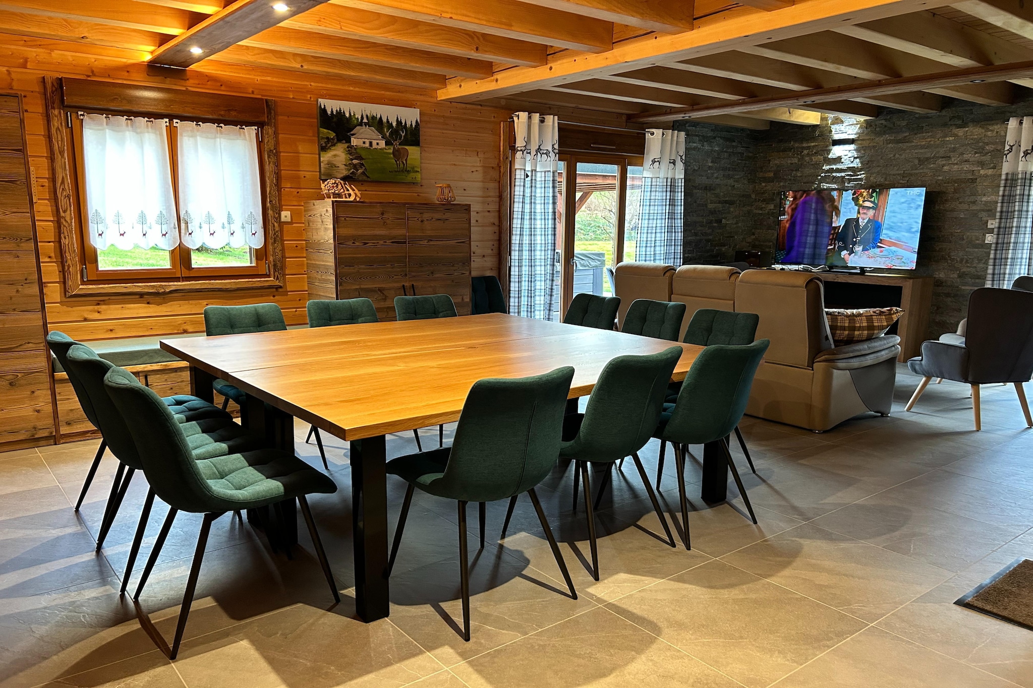 Ground floor: (hallway, Living room(TV(satellite), stove(wood), DVD player, stereo unit), open kitchen(cooker(ceramic), espresso machine, oven, microwave, dishwasher, fridge-freezer), bedroom(double bed), bathroom(jet stream, 2x washbasin), toilet, garage, fridge-freezer, billiards)\n\nOn the 1st floor: (bedroom(3x single bed), bedroom(double bed), bedroom(single bed, double bed), bedroom(single bed, double bed), bathroom(bath tub, jet stream, washbasin), toilet, sauna)\n\nAnnex: (table tennis table)\n\nwashing machine, heating(electric, floor heating), terrace, garden, garden furniture, BBQ, play equipment, children\'s bed, high chair