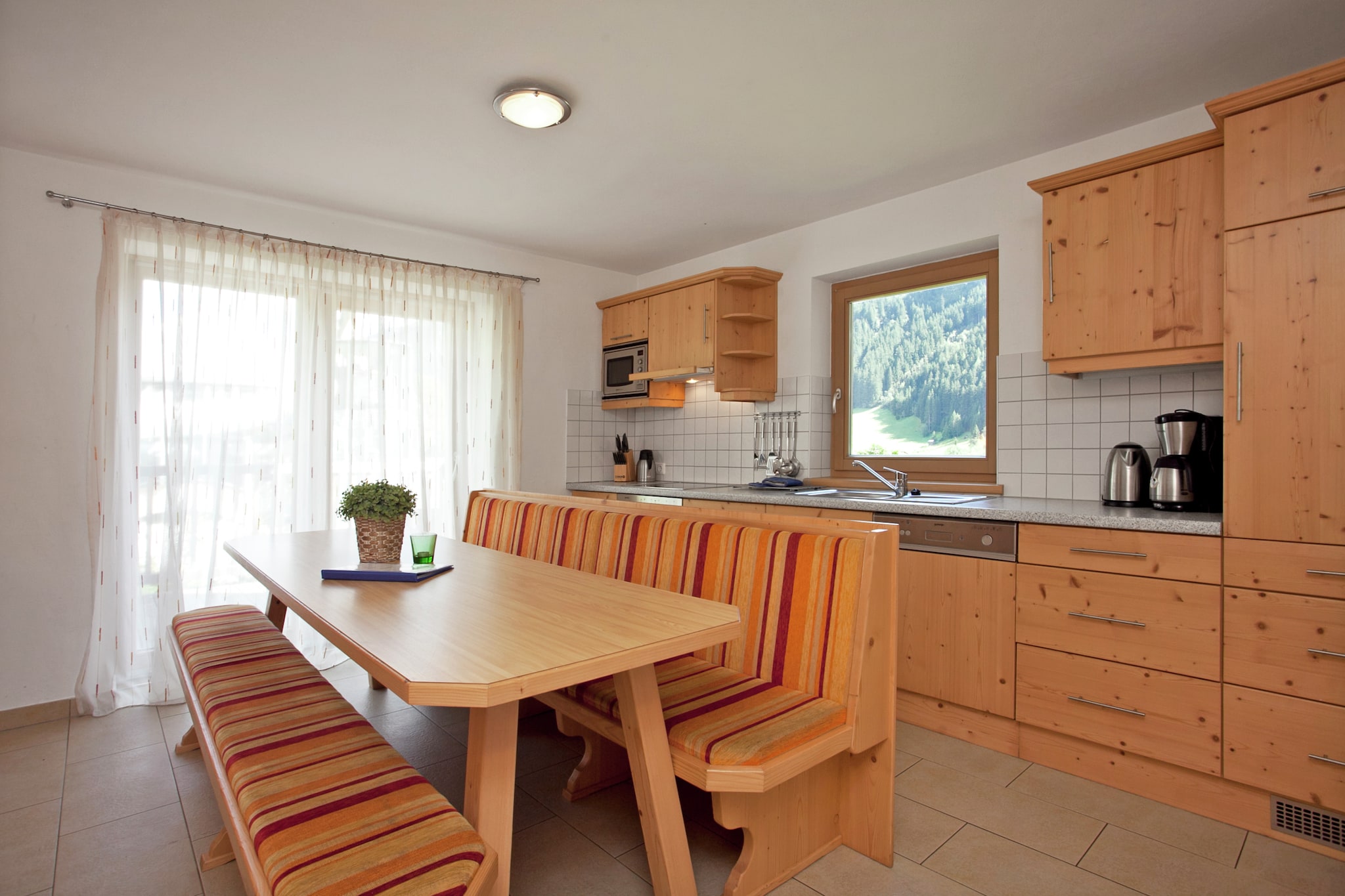 Ground floor: (Living room(TV, radio), open kitchen(oven, microwave, dishwasher), bedroom(2x bunk bed), bathroom(shower, toilet))\n\nOn the 1st floor: (bedroom(double bed, bunk bed), bedroom(double bed), bathroom(shower, toilet))\n\nbalcony or terrace, 2x parking, swimming pool(shared with other guests, roofed)