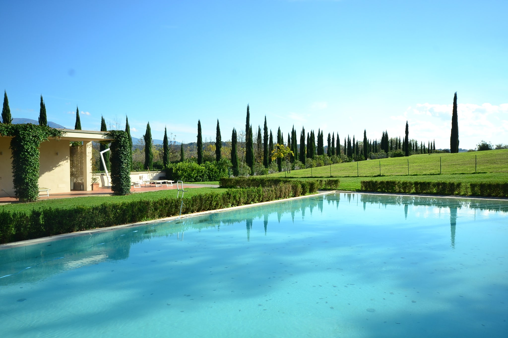 Discover the serene charm of this inviting abode nestled in the scenic hills of Rignano sull’Arno, Tuscany. Surrounded by lush landscapes and vineyards, this peaceful retreat offers a shared swimming pool, open from early May to mid-September, perfect for cooling off on warm Tuscan days. Relax in the shared garden furnished with comfortable seating, ideal for unwinding with a book or enjoying a sunny afternoon. Families appreciate the welcoming atmosphere and spacious surroundings, making it easy to connect with nature and each other.
Just 100 meters away, there are delightful local restaurants invite you to savor authentic Tuscan cuisine, while the town center of Rignano sull’Arno, only 4.4 km away, offers supermarkets, shops, and additional dining options. The renowned Chianti region lies nearby, famed worldwide for its exceptional wines—wine enthusiasts can take guided tours and enjoy tastings at prestigious wineries, immersing themselves in the rich flavors and traditions of the area.
For cultural explorers, Florence is just 34 km away, offering a treasure trove of Renaissance art, historic landmarks, and vibrant city life. Pisa, with its iconic Leaning Tower, and the charming towns of Lucca and Arezzo are also within comfortable reach for memorable day trips. After a day of adventure, return to your tranquil holiday home where heating and air conditioning ensure comfort year-round, and on-site parking adds convenience to your stay.
Whether you’re drawn by Tuscan wines, cultural heritage, or peaceful countryside, this holiday home in Rignano sull’Arno promises an authentic and rejuvenating experience at the heart of Tuscany.