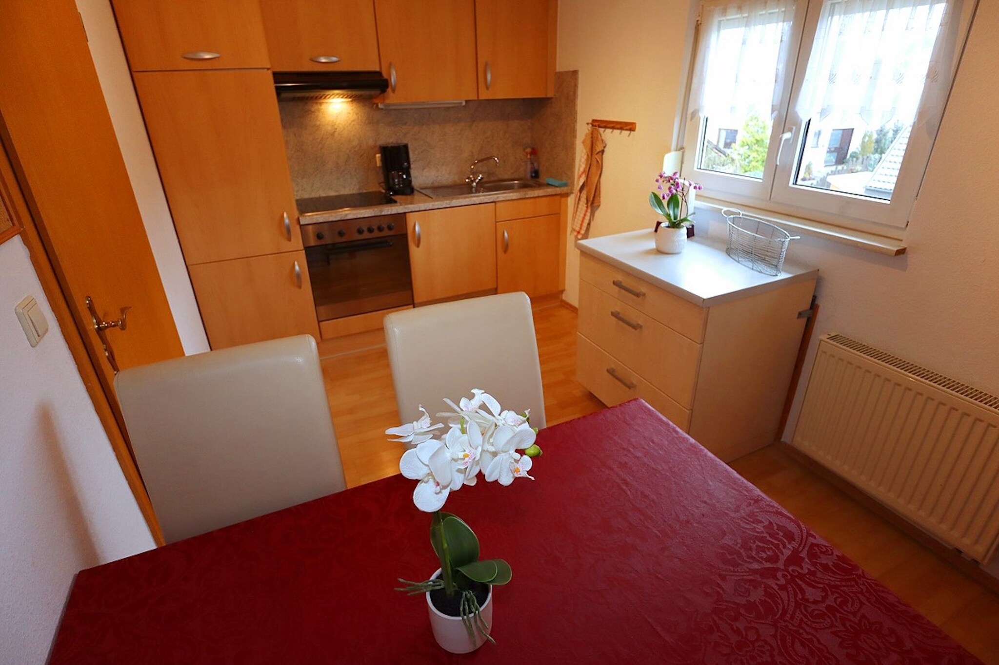 Attic: (Living room(TV(satellite), radio, stereo unit), Large kitchen(electric kettle, toaster, cooker(4 ring stoves, ceramic), coffee machine(filter), oven, combination microwave, microwave, dishwasher, fridge, freezer), bedroom(double bed), bedroom(2x single bed), bathroom(shower, washbasin, toilet, hairdryer))\n\nstorage, tumble dryer(shared with other guests), washing machine(shared with other guests), heating(central), garden(shared with other guests, partially fenced), BBQ(charcoal), parking, high chair, ironing board, iron, party games, Swing set