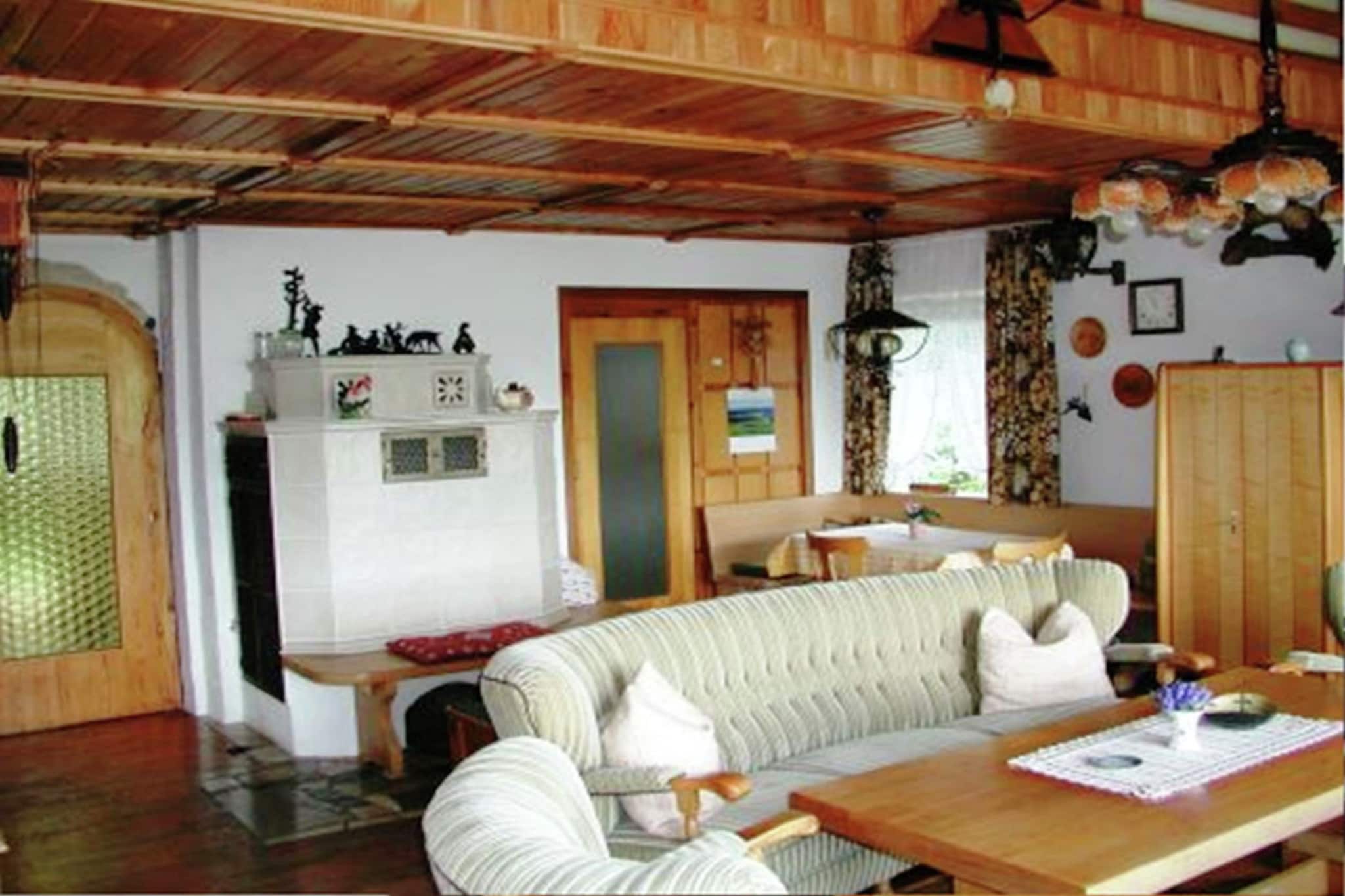 This cosy semi-detached holiday home is located in the state-approved health resort of Tännesberg, in the Upper Palatinate Forest, Bavaria. Ideal for families or a small group, it accommodates up to 5 people with 2 bedrooms, free WiFi, and is pet-friendly. A tiled stove in the living room adds to the warm, homely charm.

The home sits near the geological nature trail and the popular Goldsteig long-distance hiking route. Nearby attractions include the Upper Palatinate Lake District with great water sports and scenic views, as well as a natural swimming pond, a high ropes course, and a fruit trail. The panoramic terrace offers peaceful views of meadows and forests.

Excursions to Weiden, Amberg, Regensburg, Weltenburg Abbey, Pilsen, and Prague are highly recommended. The nearest airport is Hof–Plauen Airport, around 116 km away.