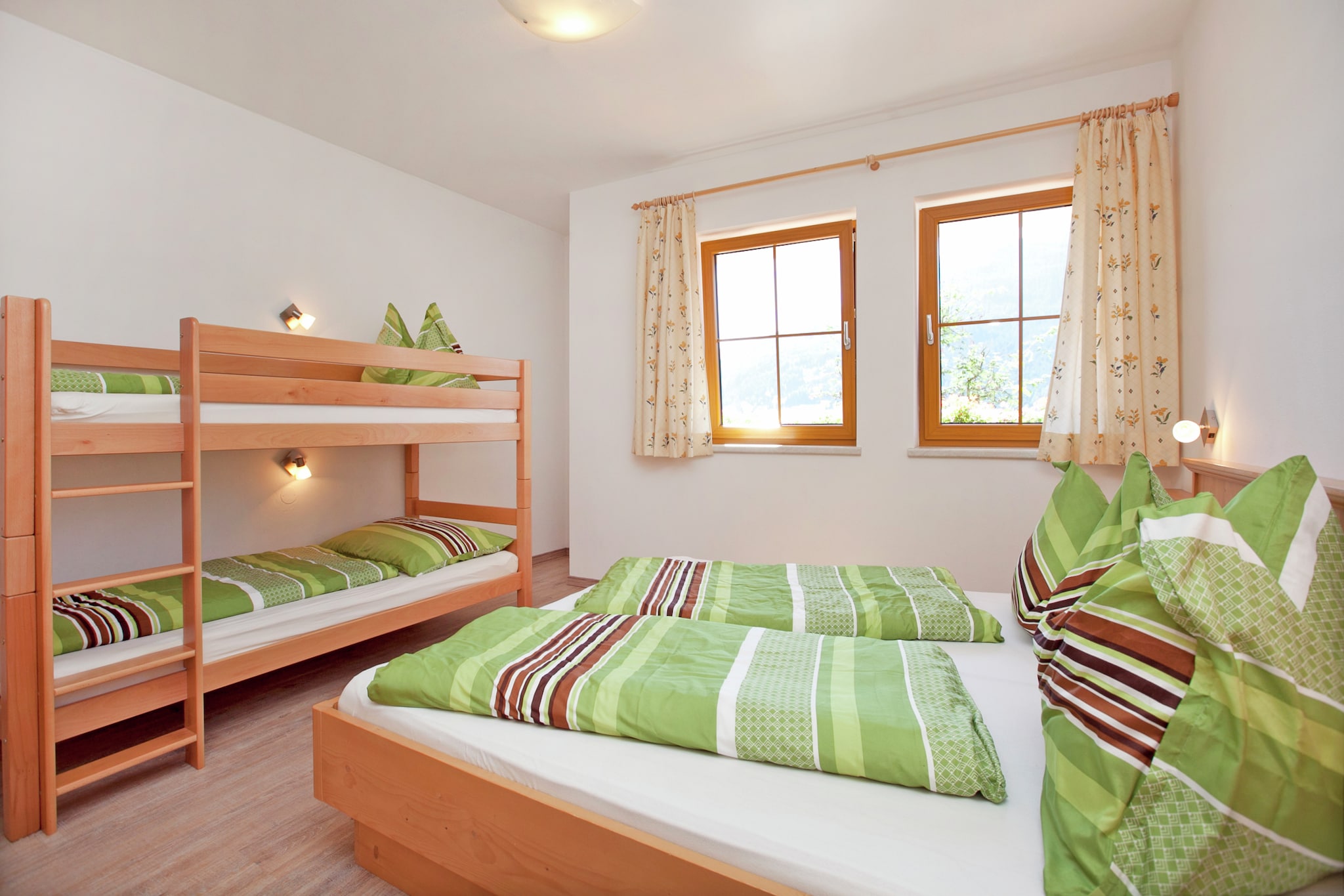 Ground floor: (ski storage(ski boot heaters))\n\nOn the 1st floor: (Entrance, open kitchen(electric kettle, cooker(4 ring stoves, ceramic), coffee machine(filter), oven, microwave, dishwasher, fridge-freezer), Living/diningroom(double sofa bed, TV(flatscreen), dining table, seating area, radio, balcony), bedroom(double bed, bunk bed), bedroom(double bed), bathroom(shower, infrared sauna, washbasin), toilet, storage, terrace(shared with other guests, roofed))\n\nheating(floor heating), garden furniture, parking, trampoline, play equipment