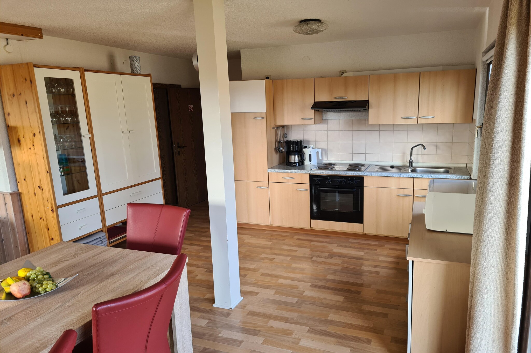 Ground floor: (Entrance, hall, open kitchen(cooker(4 ring stoves), oven, microwave, fridge-freezer), Living/diningroom(double sofa bed, TV(satellite), stove(wood)), bedroom(bunk bed), bedroom(2x single bed), bathroom(shower, washbasin, toilet, washing machine), toilet)\n\ncot, terrace, garden(shared with other guests), garden furniture, high chair