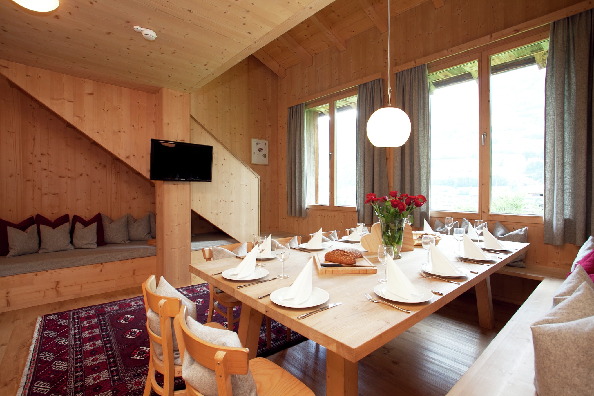 This modern apartment, located in Ramsau im Zillertal, features 5 bedrooms for 10 people. Perfect for families or friends, guests can relax in the infrared sauna and access free WiFi att his child-friendly property.
The town center is located 500 m away, around which you can explore restaurants, experience the local nightlife and go for cross country. You can visit several ski slopes in the Zillertal region, accessible through a ski bus plying from 50 m away of the apartment.
Nestled on the slope of a hill, guests can lounge in the beautiful garden with a hot barbecue and enjoy the delightful landscape view. The kitchen is fully equipped to cook a scrumptious meal while the living room offers a comfortable place to unwind. For your skiing adventures, a ski storage with ski boot heaters is also featured. This child-friendly property also features a chidlrenÂ’s bed and high chair.
Public transport is available 200 m away.