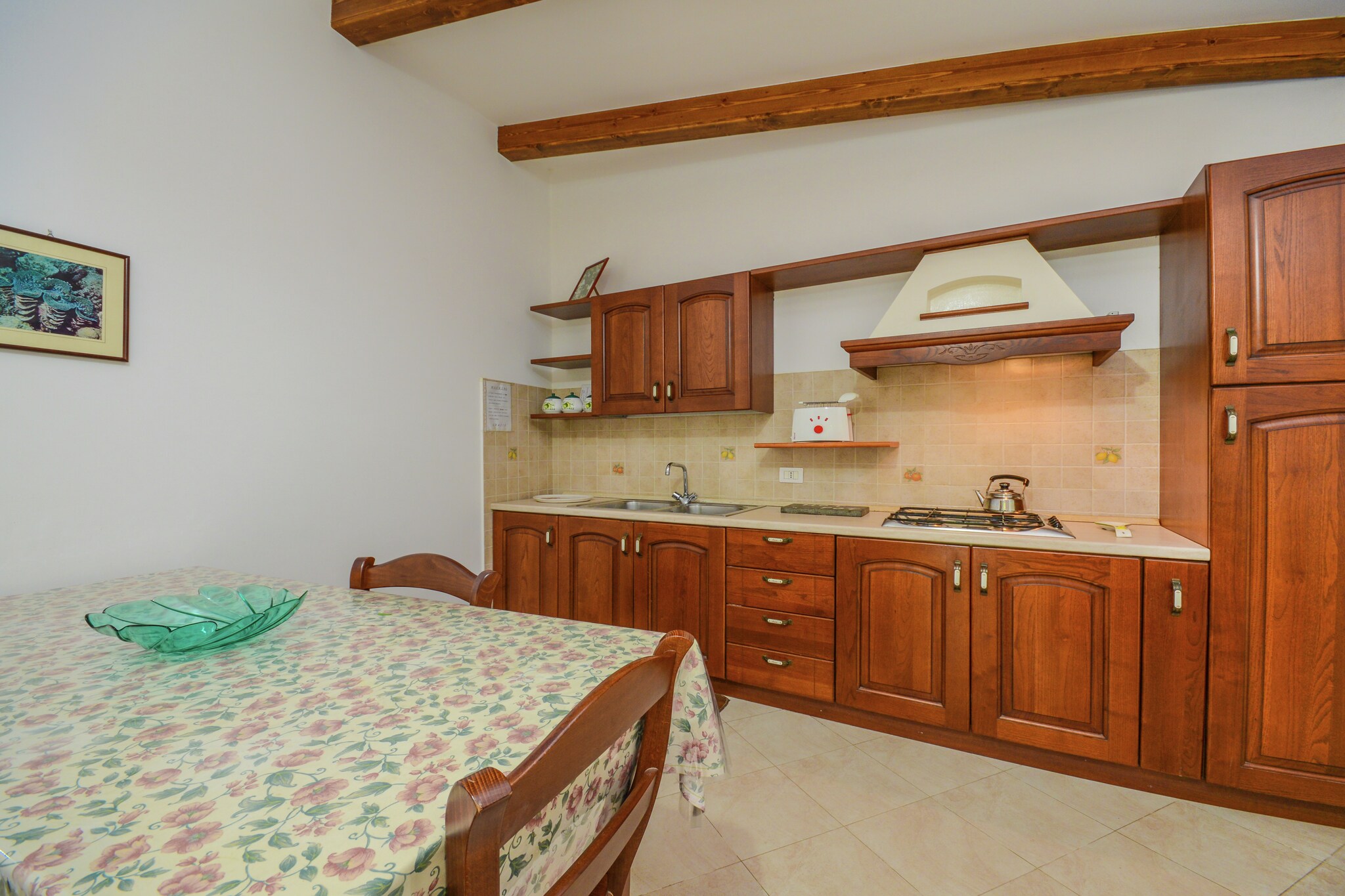 Elegant Retreat in Sorrento
Nestled within the enchanting streets of Sorrento, this charming mansion offers a peaceful escape while retaining proximity to the vibrant city centre. With a tastefully decorated interior and a lush shared garden, guests can unwind in a serene atmosphere surrounded by the fragrance of citrus groves and the soft sea breeze. The shaded garden is perfect for leisurely breakfasts or evening relaxation, and thoughtful touches, such as a high-quality coffee machine and air conditioning, make every stay comfortable. Whether you're enjoying the peaceful surroundings or preparing for a day of exploration, this home is your cozy base in Sorrento.
Explore Coastal Wonders
Sorrento is a perfect blend of beauty and history, perched dramatically above the Bay of Naples. Explore the charming lanes of the historic centre, admire panoramic views from Villa Comunale, or hop on a boat to Capri or Positano. For cultural immersion, visit the Museo Correale or take a scenic train ride to Pompeii and Herculaneum. Nearby beaches like Marina Grande offer clear waters and picturesque settings, while cliffside viewpoints showcase the region’s unforgettable sunsets.
Flavours of the Mediterranean Await
Indulge in the rich culinary scene Sorrento has to offer, with authentic trattorias and fine dining all just minutes away. Dine at Ristorante L’Antica Trattoria for a romantic atmosphere and traditional dishes, or try Il Buco, a Michelin-starred gem offering modern Italian cuisine. For a local favourite, Da Emilia in Marina Grande serves fresh seafood right on the seafront.