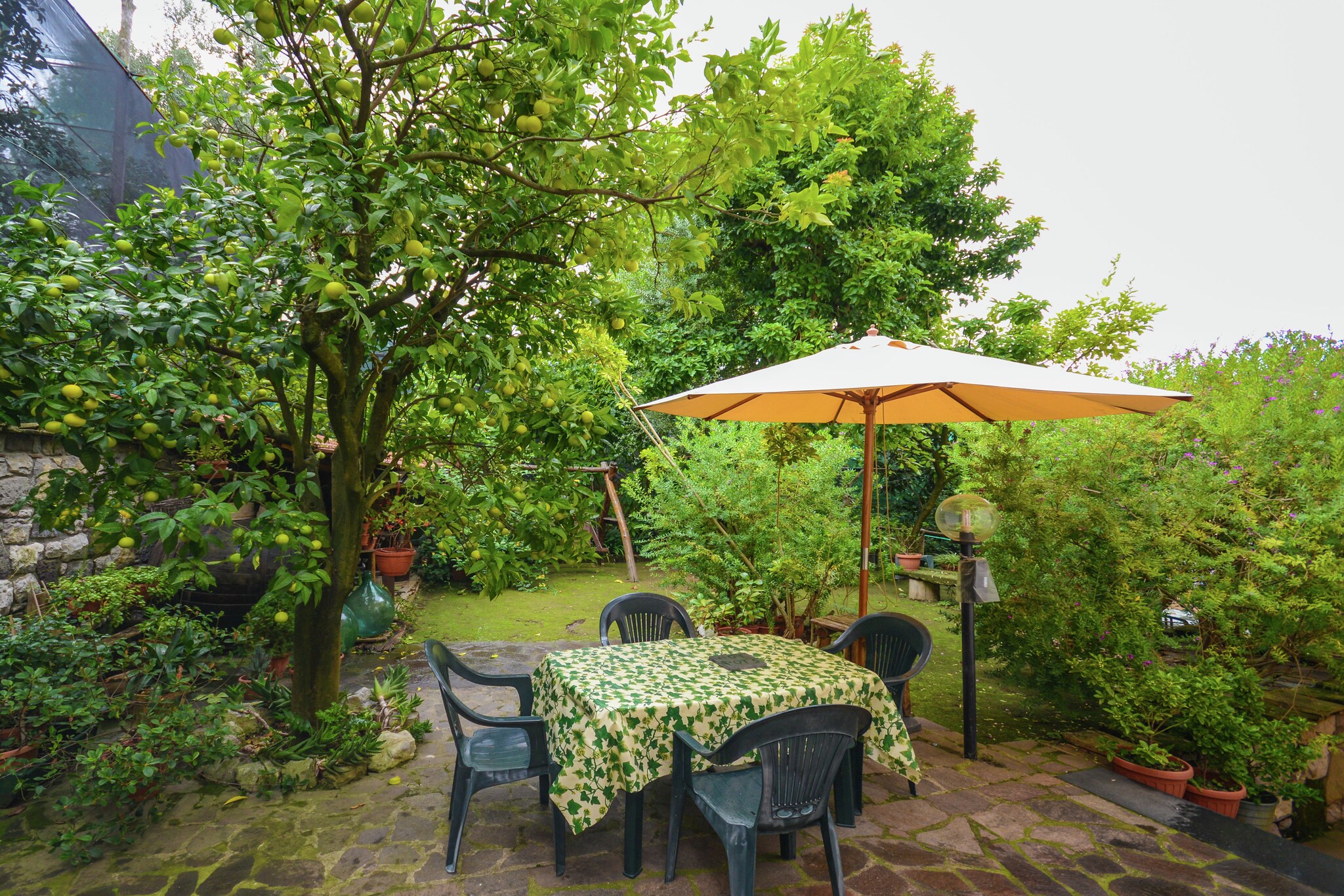 Ground floor: (Living room(2x single bed, TV), open kitchen(coffee machine(filter)), bedroom(double bed), bathroom(shower, washbasin, toilet, bidet))\n\nwashing machine, heating, air conditioning, garden(shared with other guests, 300 m2), garden furniture